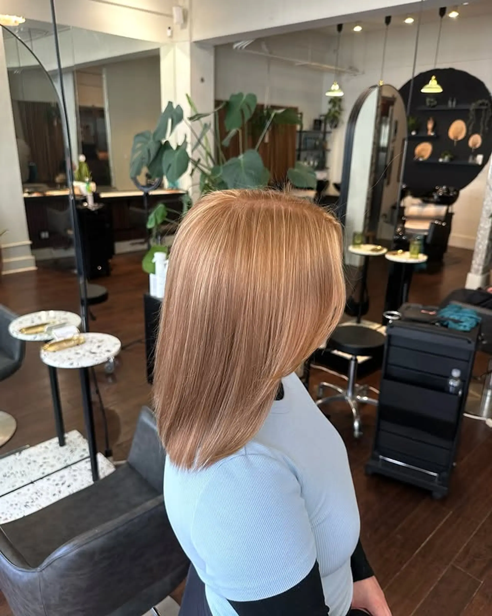 A stylish and easy-to-maintain lob with subtle layers and a soft, face-framing cut. The copper color enhances the overall look, making it a trendy choice. 1