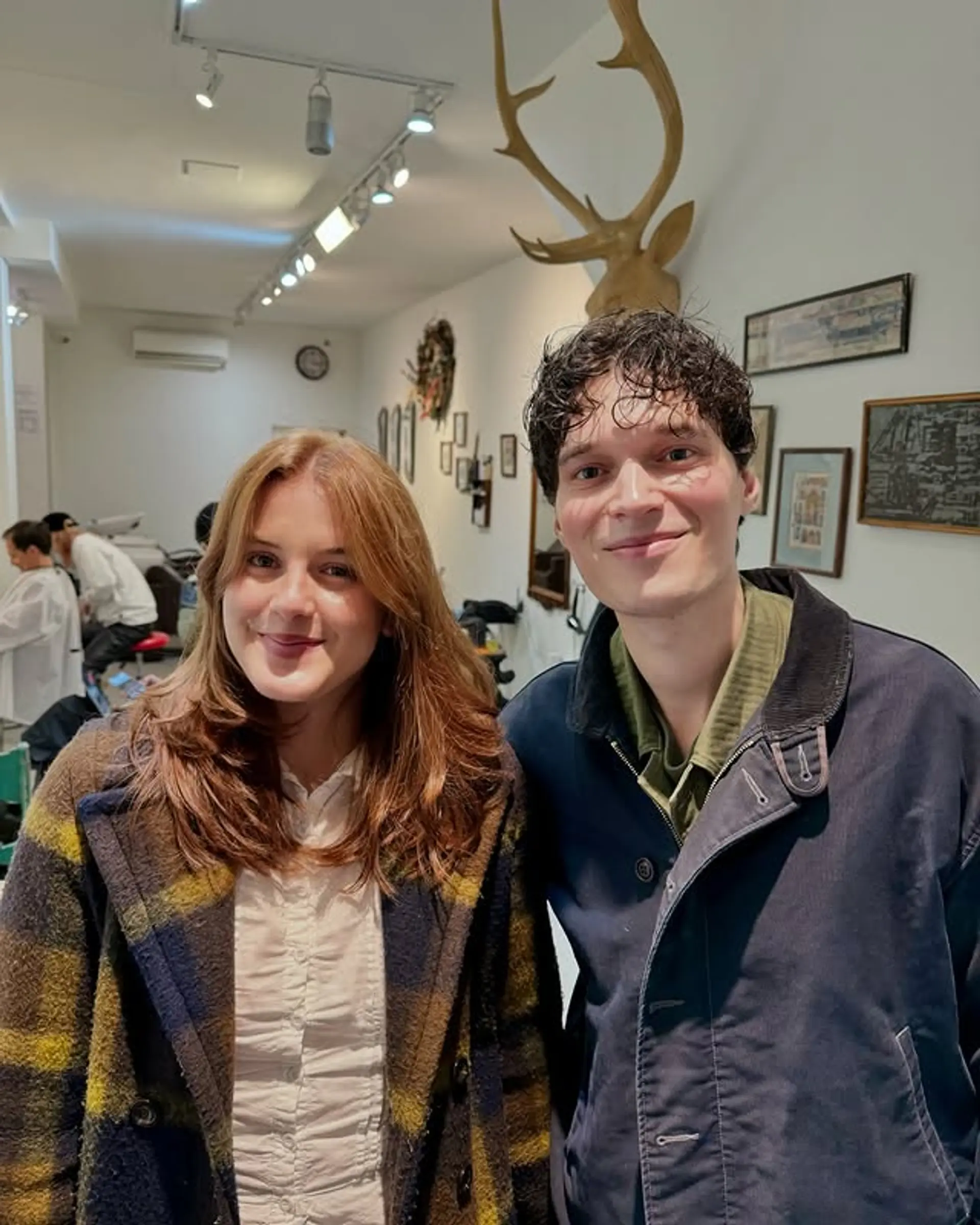 A medium-length, layered hairstyle with soft, face-framing layers. 1