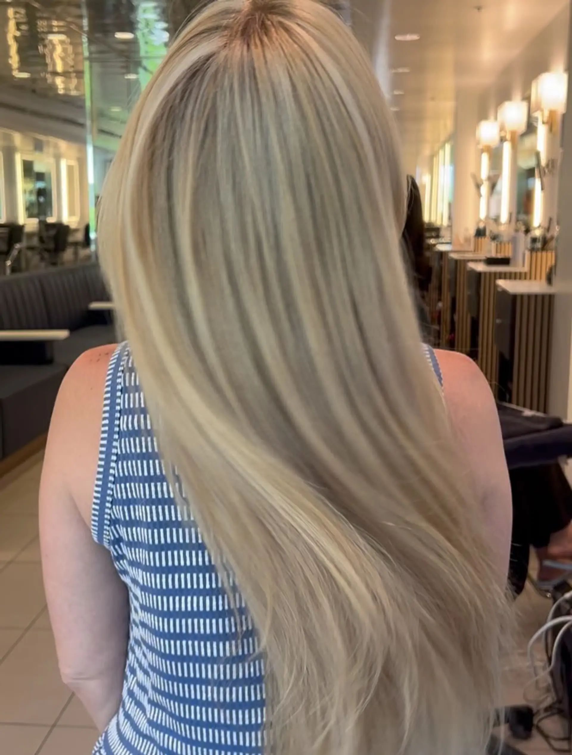 Ultra-long, sleek platinum blonde hair styled smooth and straight with soft natural movement. 1