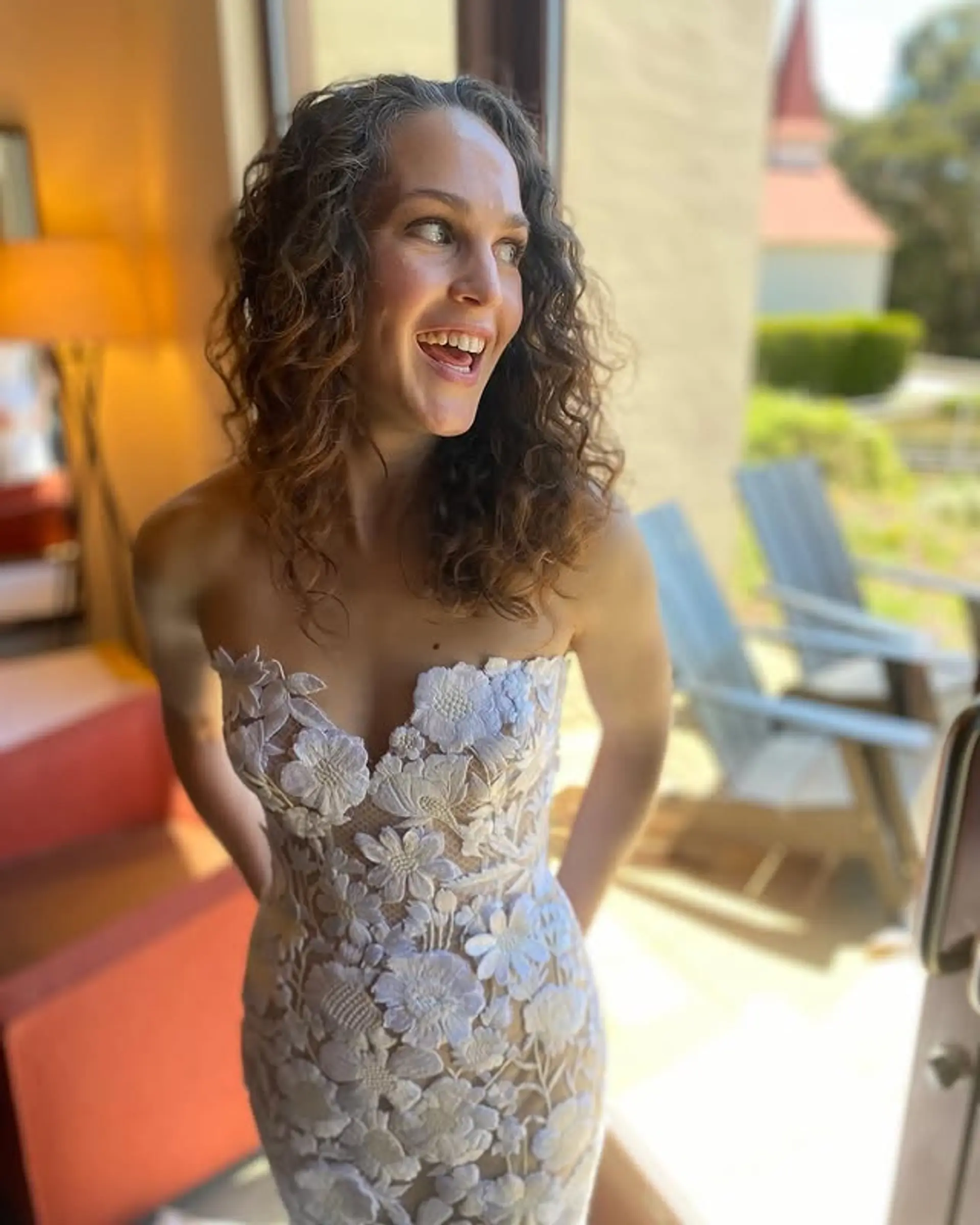 A romantic, natural curly hairstyle, styled for a special event. 1