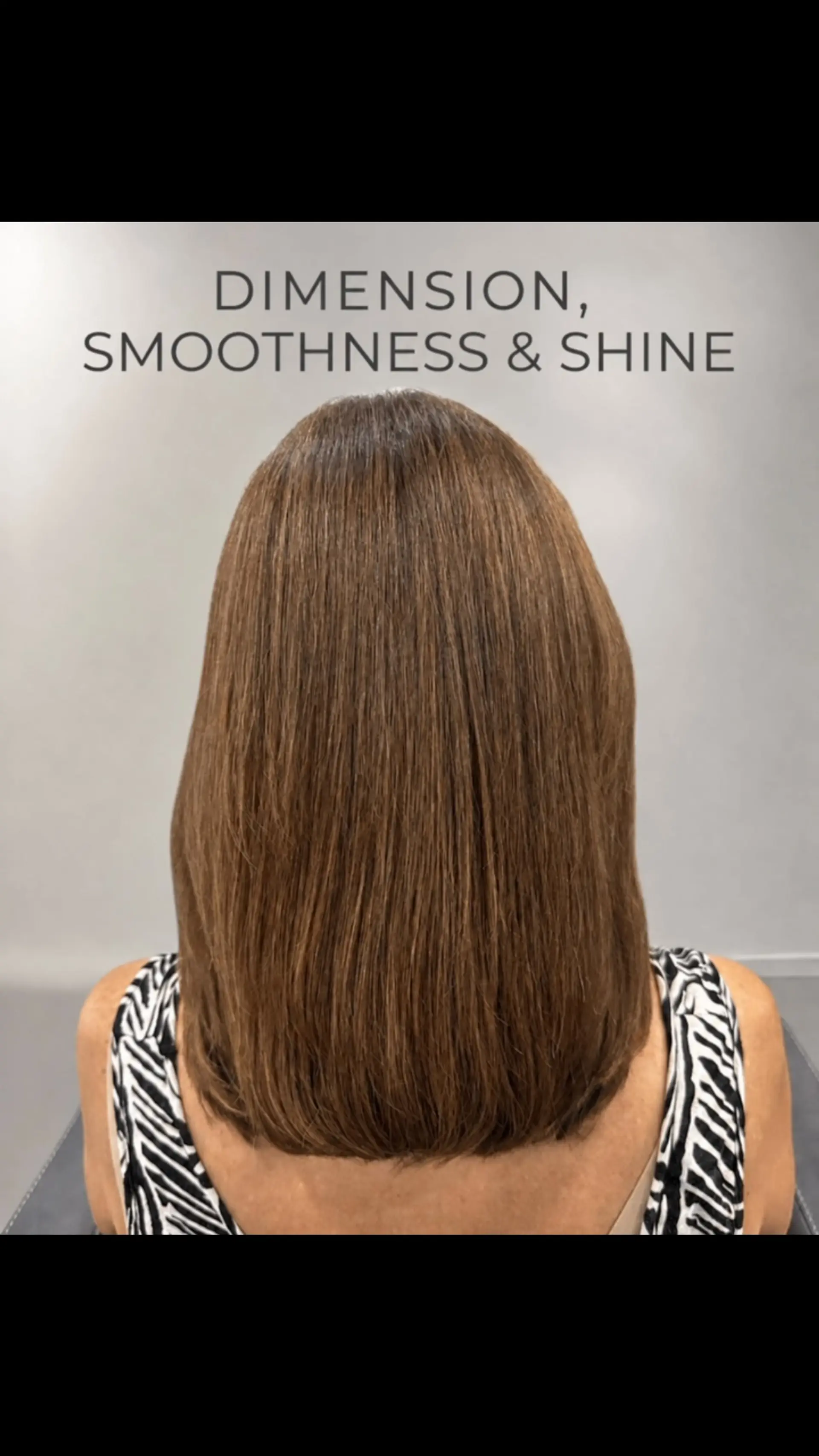 A sleek, straight medium-length brunette cut with rich dimension and a glossy, smooth finish. 1