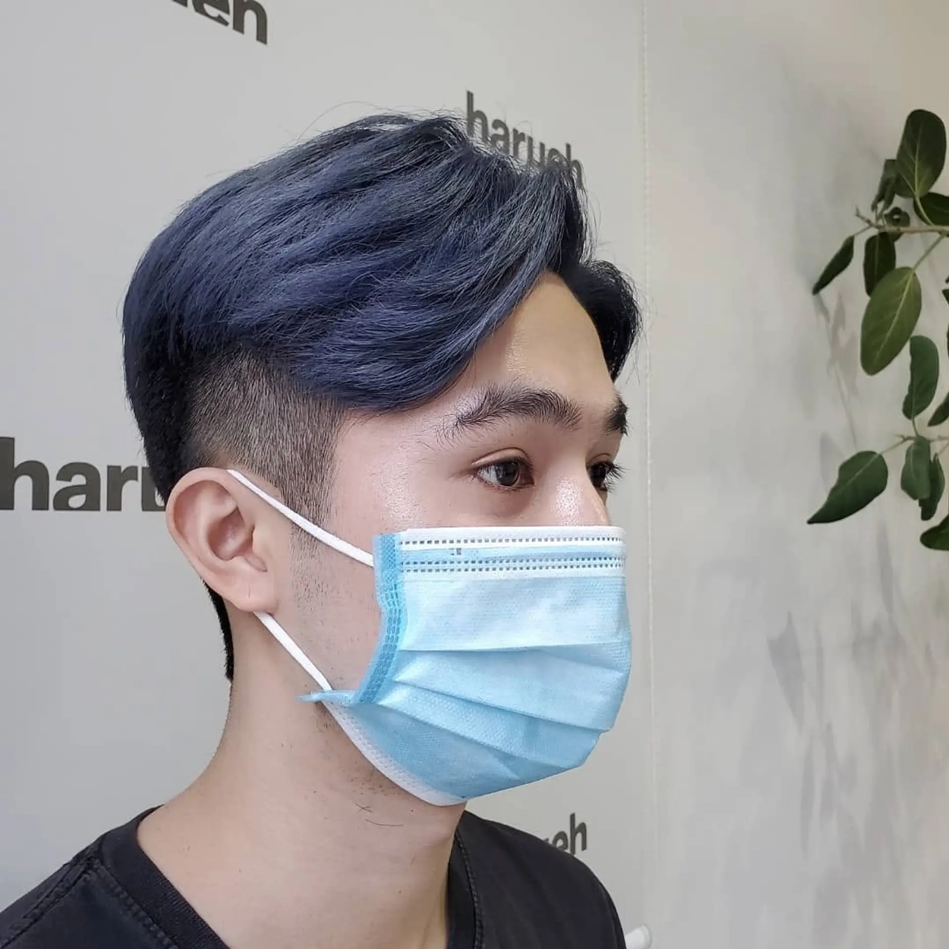 A modern two-block cut with a short, tapered fade on the sides and back, paired with longer, textured layers on top that offer volume and movement. 1