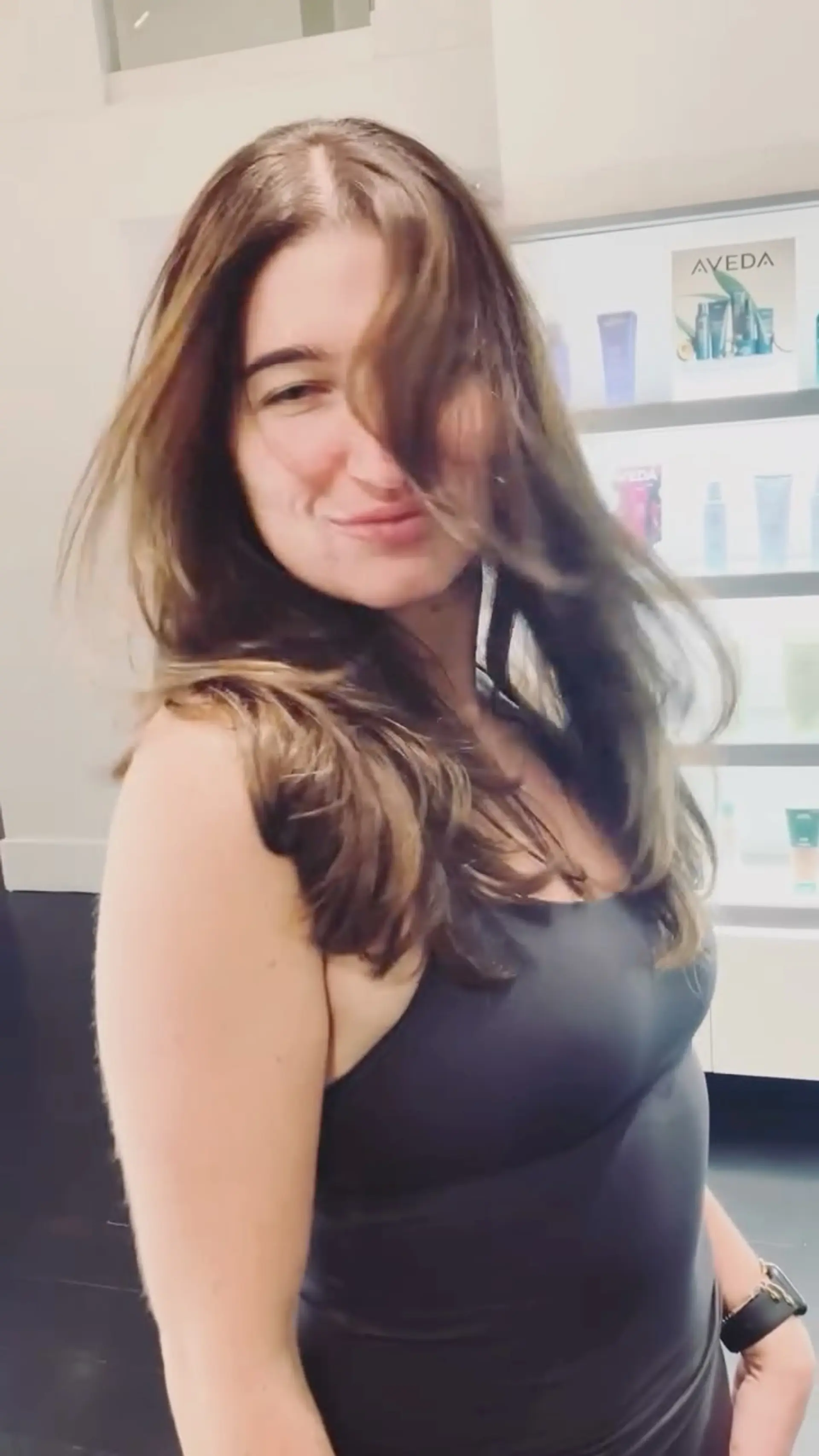 Voluminous 90s-style layered blowout on dimensional medium brunette hair with lots of movement. 1