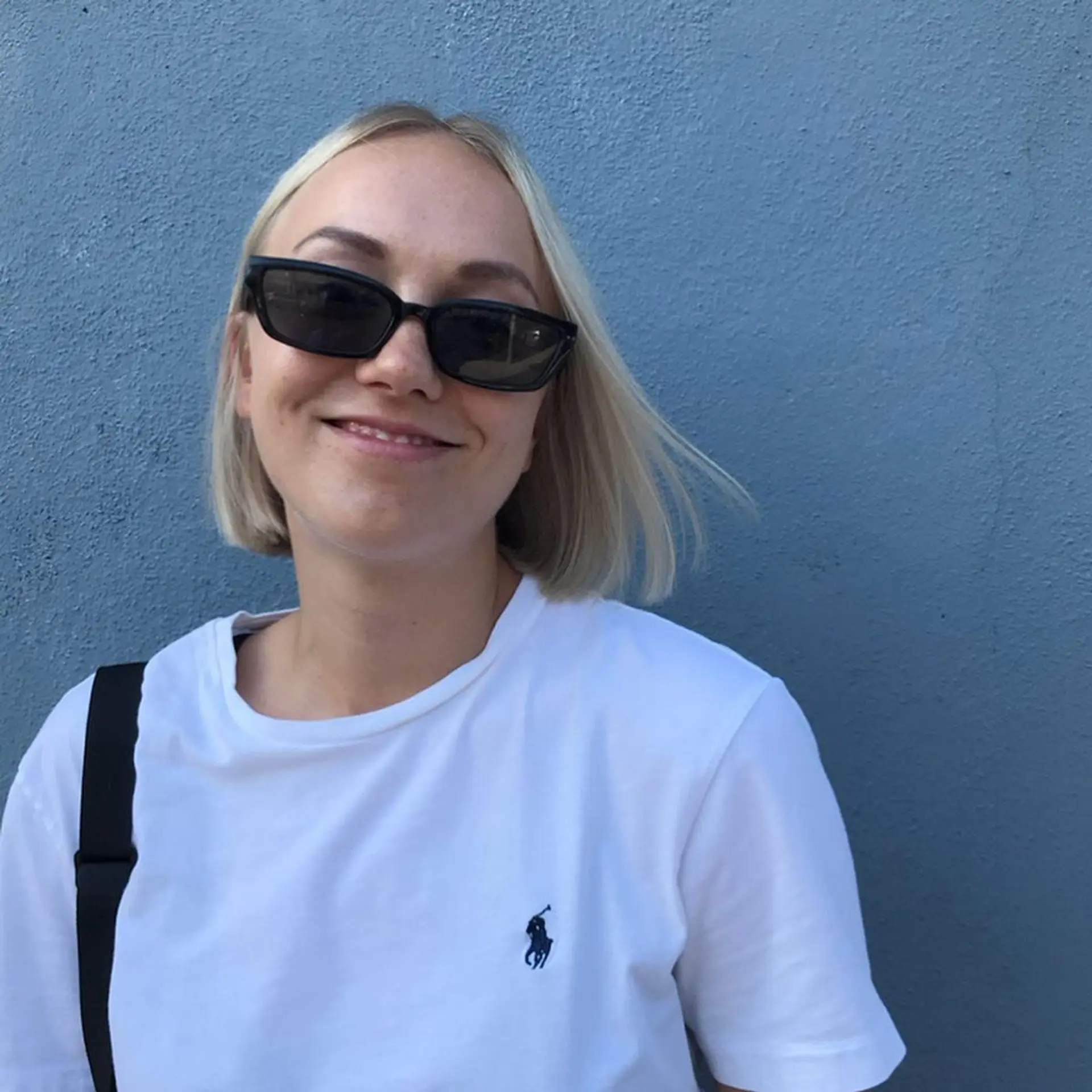 Medium-length platinum blonde straight hair in a classic blunt bob with a glossy finish and a subtle side part. 3