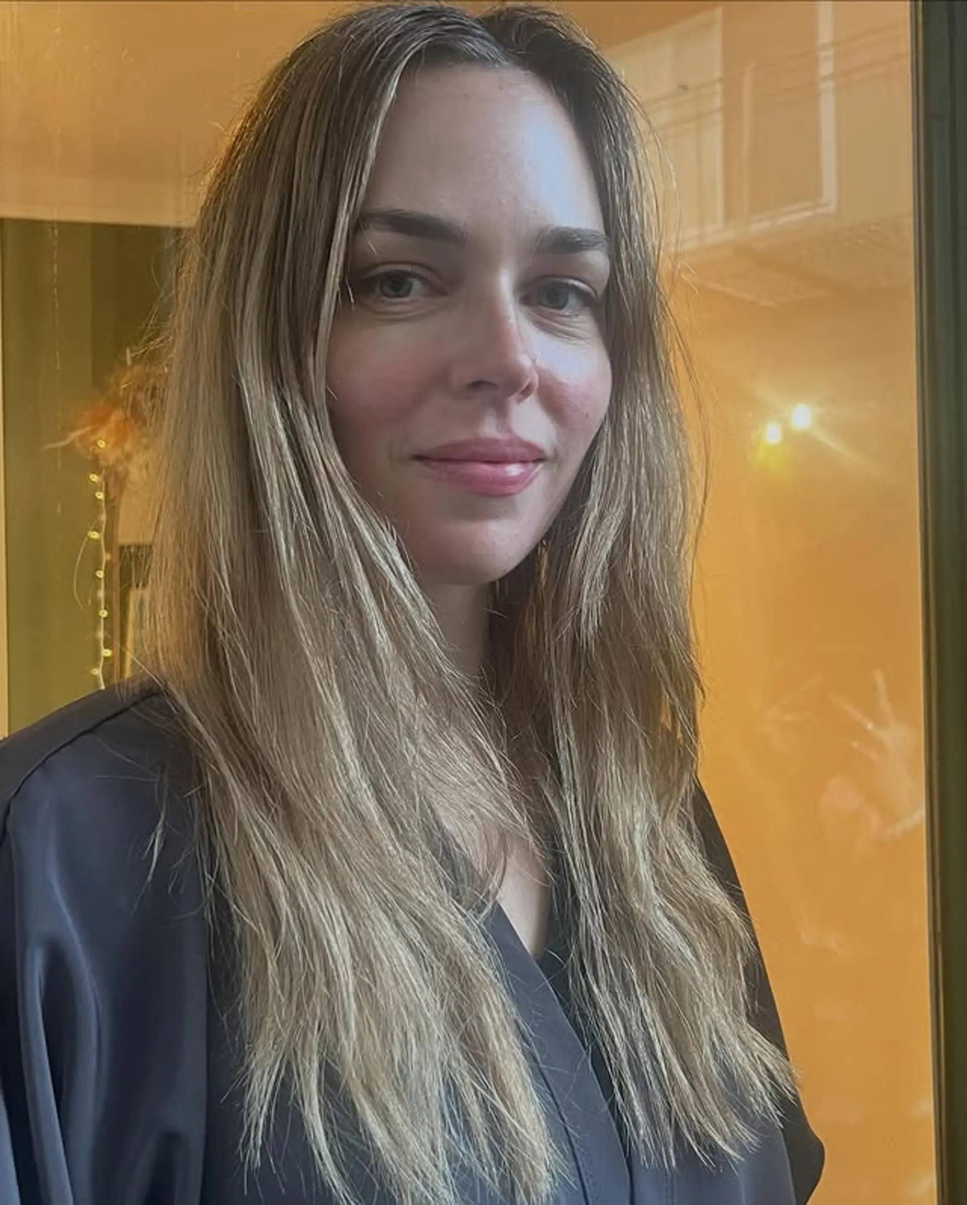 Long, layered hairstyle with a subtle balayage. 1