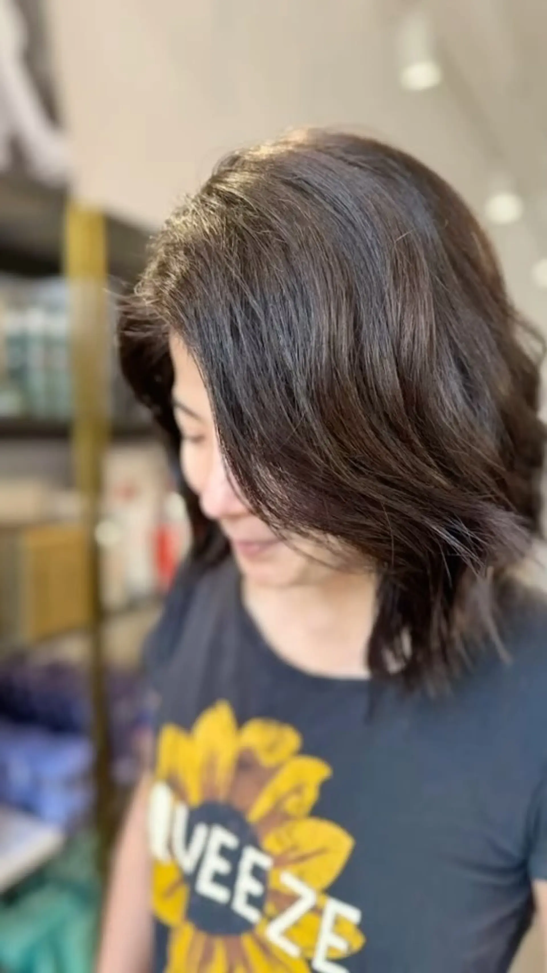Shoulder-grazing dark brown hair with soft layers, a side part and natural movement. 1
