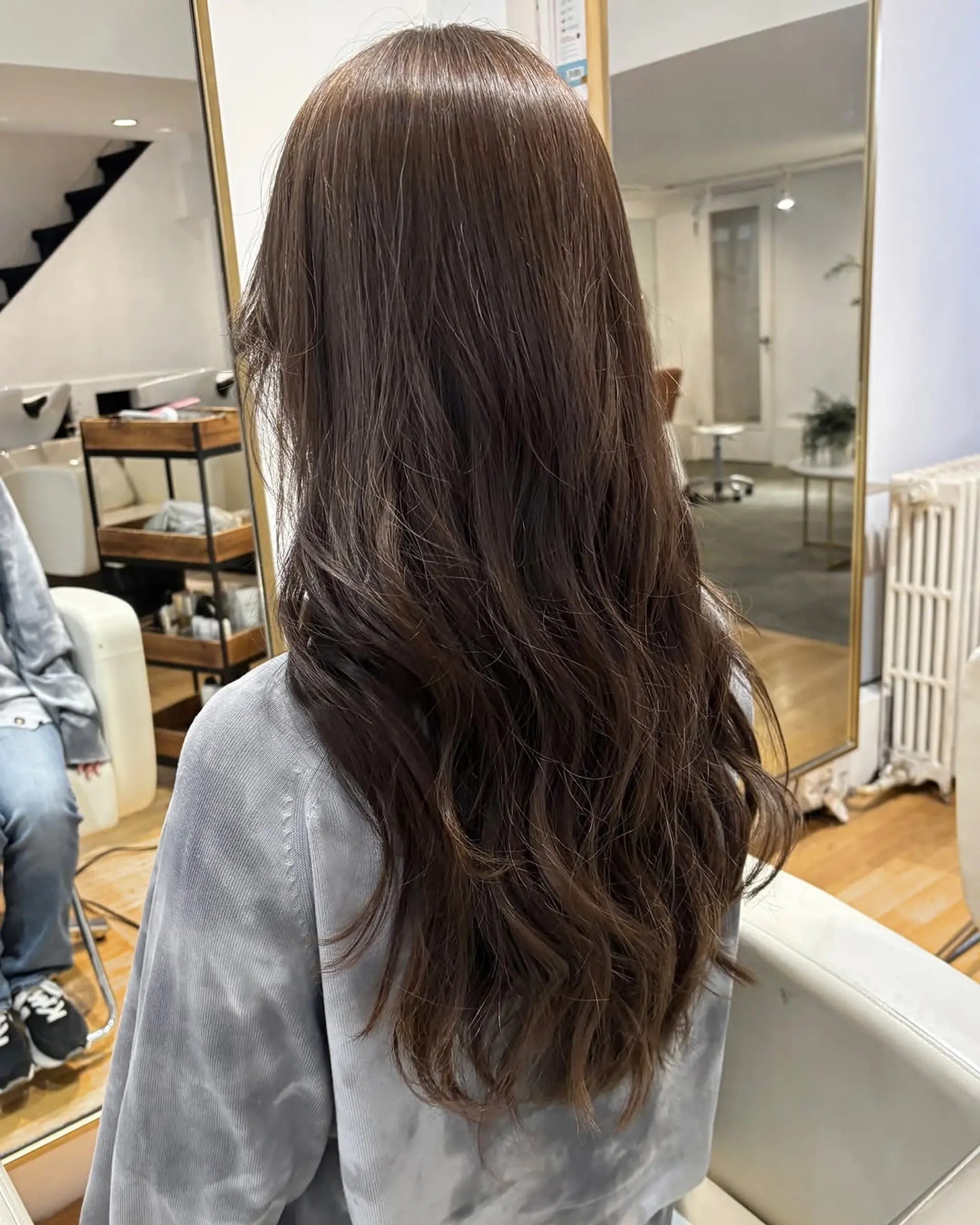 Long, layered waves in a rich brunette shade. 1