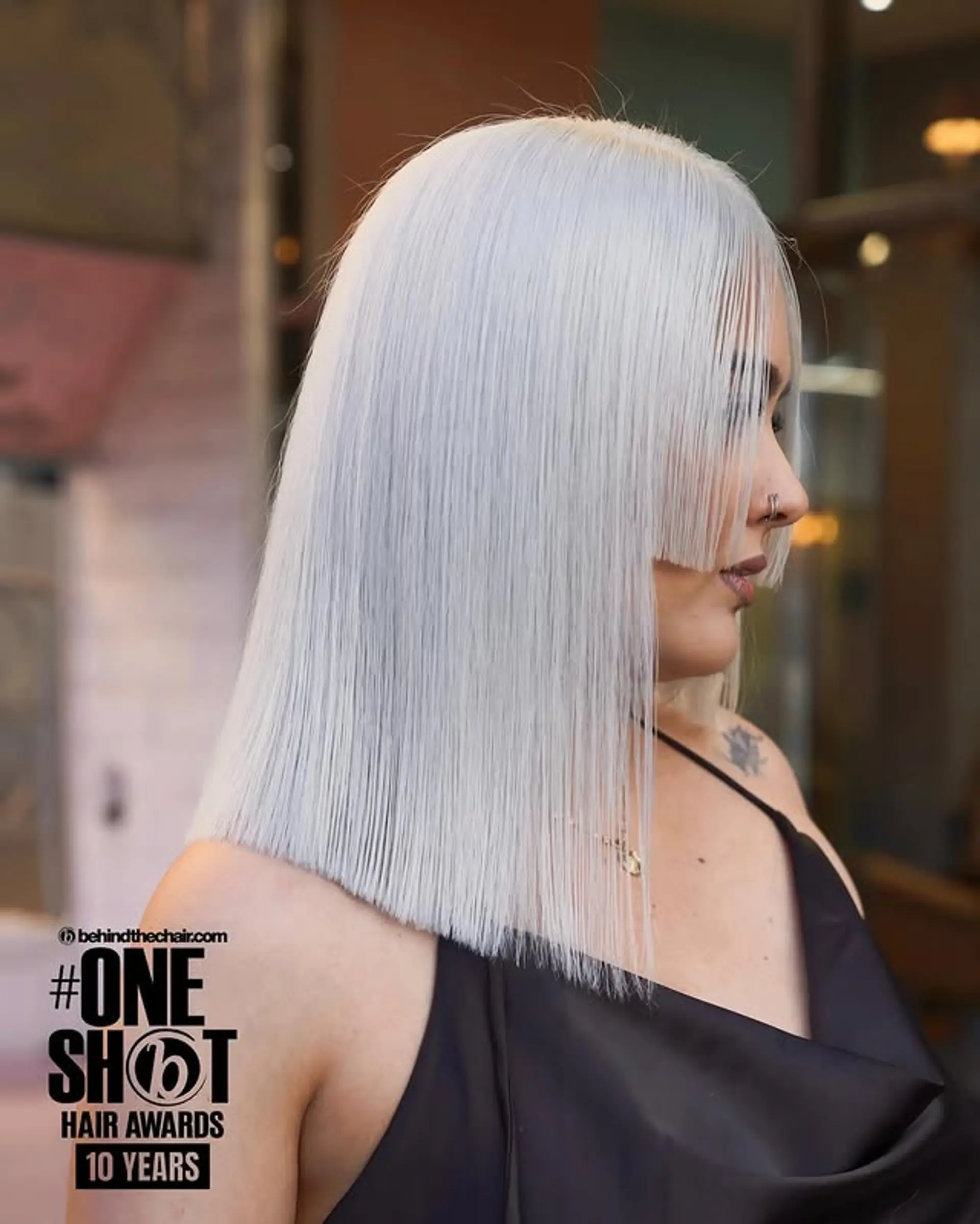 A blunt, medium-length bob with very short, face-framing fringe. 1