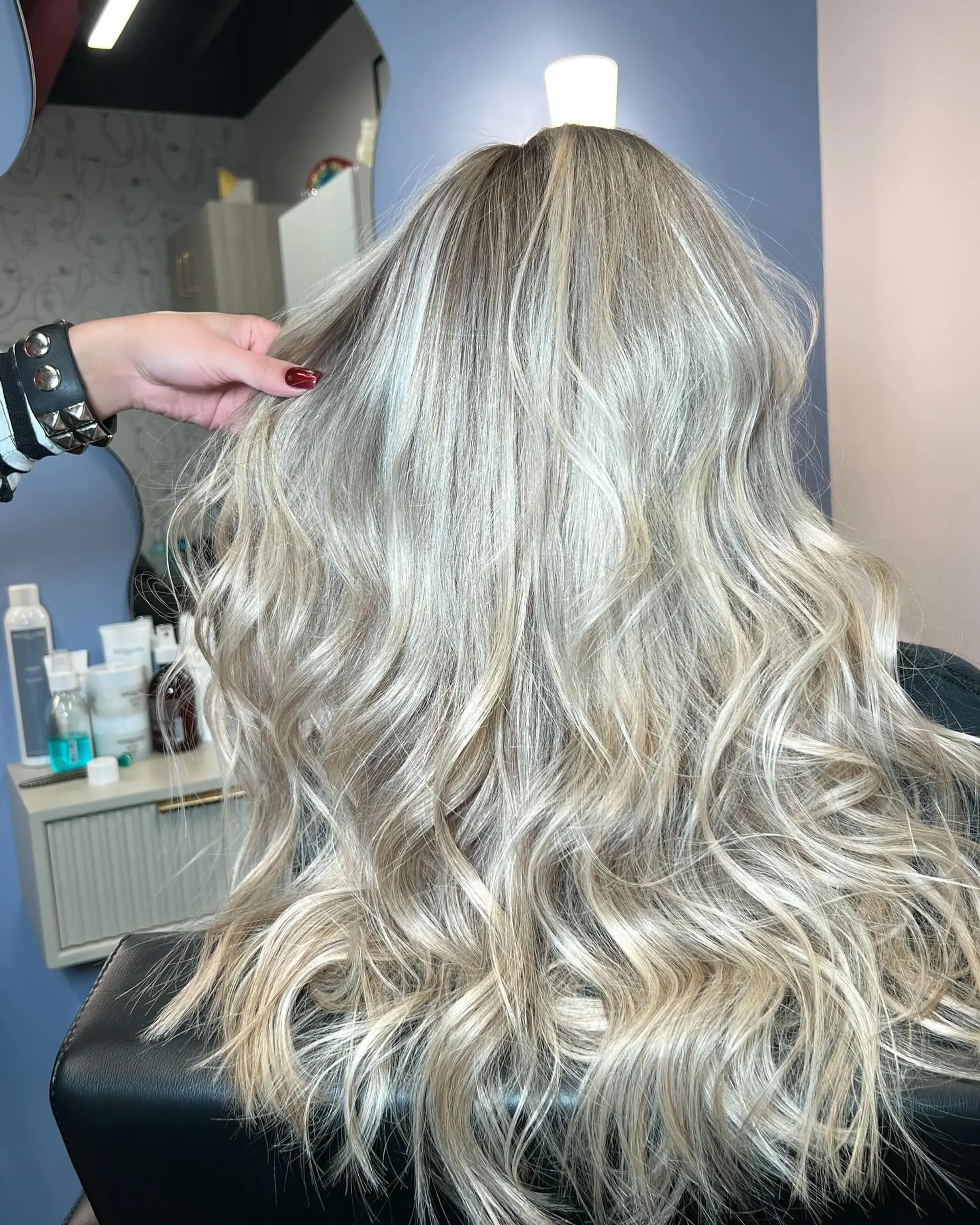 A long, wavy hairstyle with an icy blonde balayage. 1