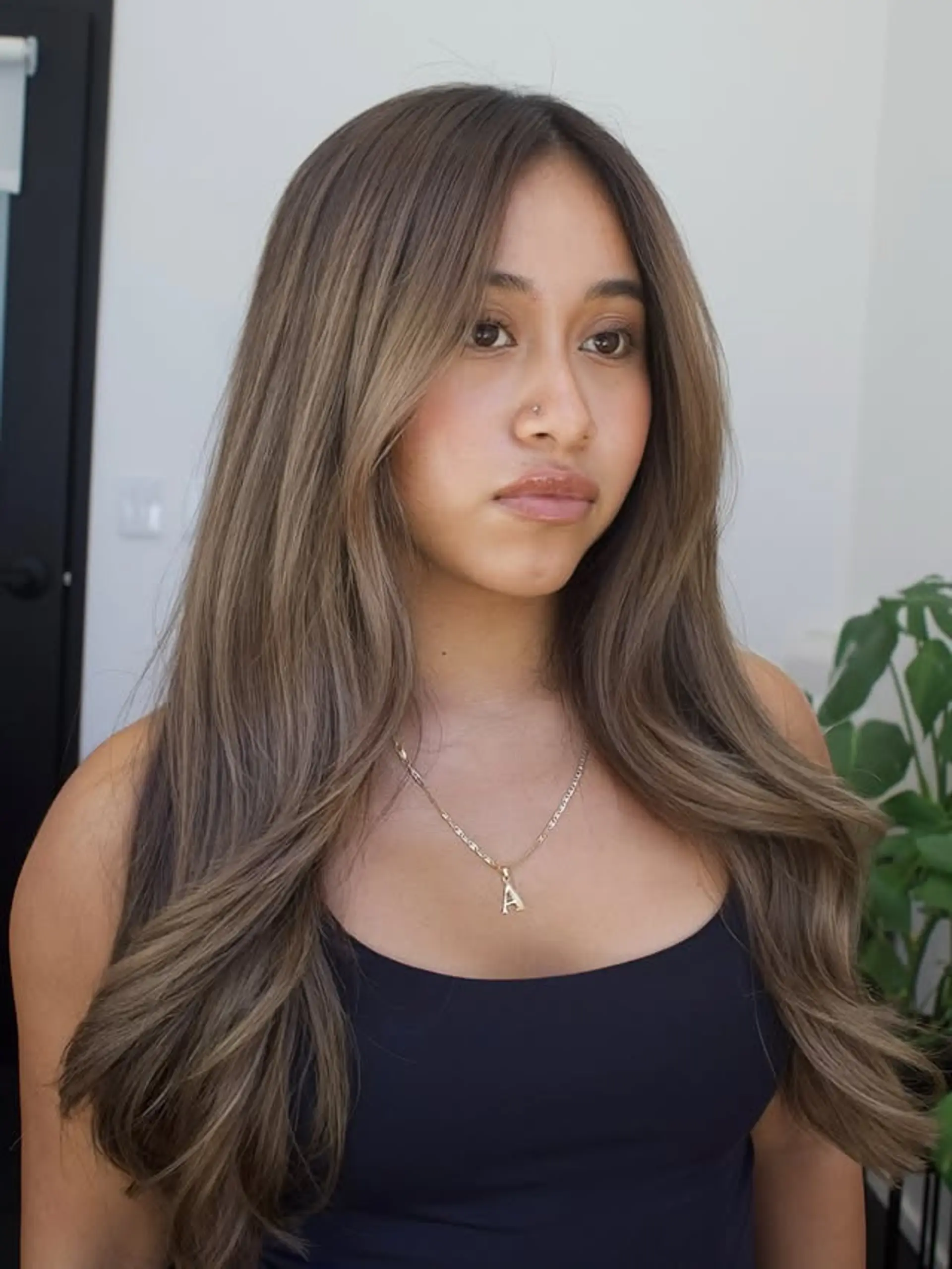 Bronde balayage with subtle face-framing layers for a soft and dimensional look. 1