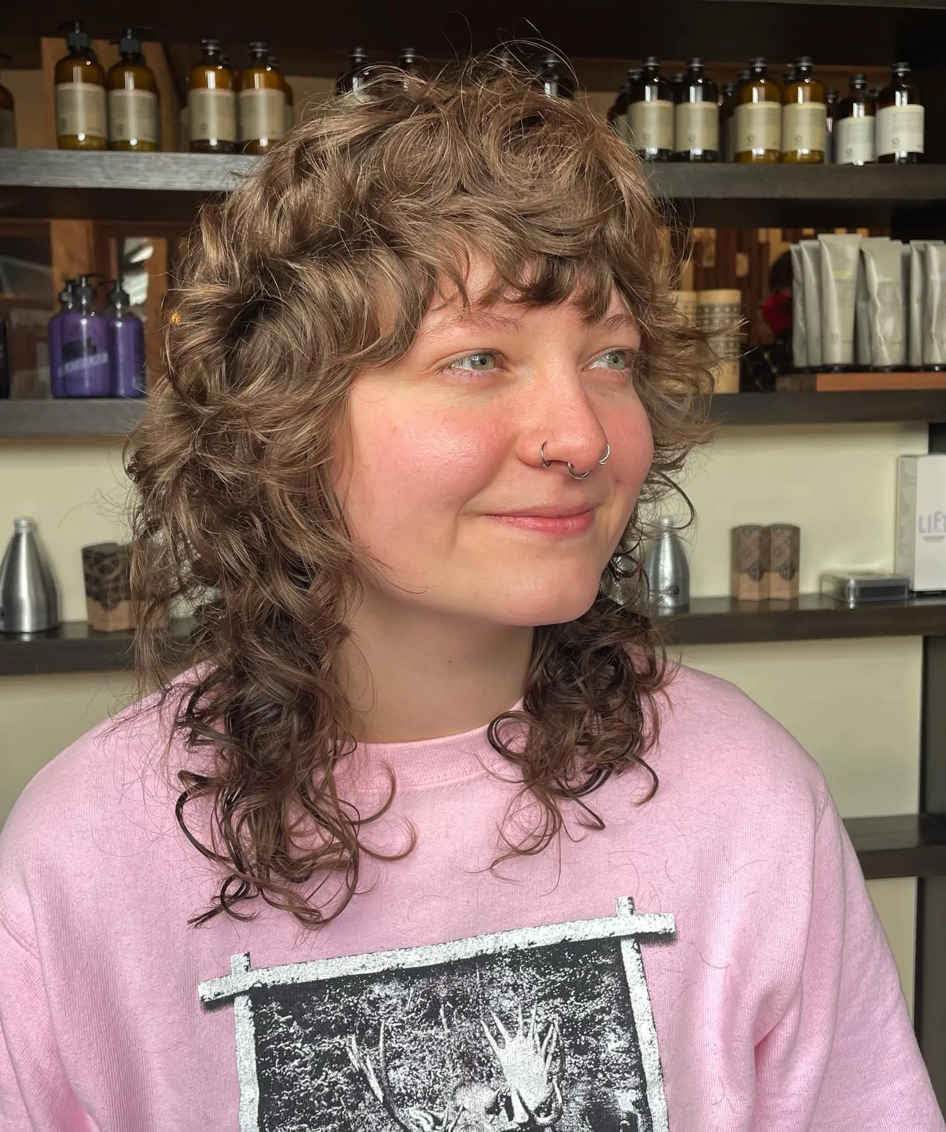 A layered, curly shag with a mullet silhouette and a face-framing fringe. 1