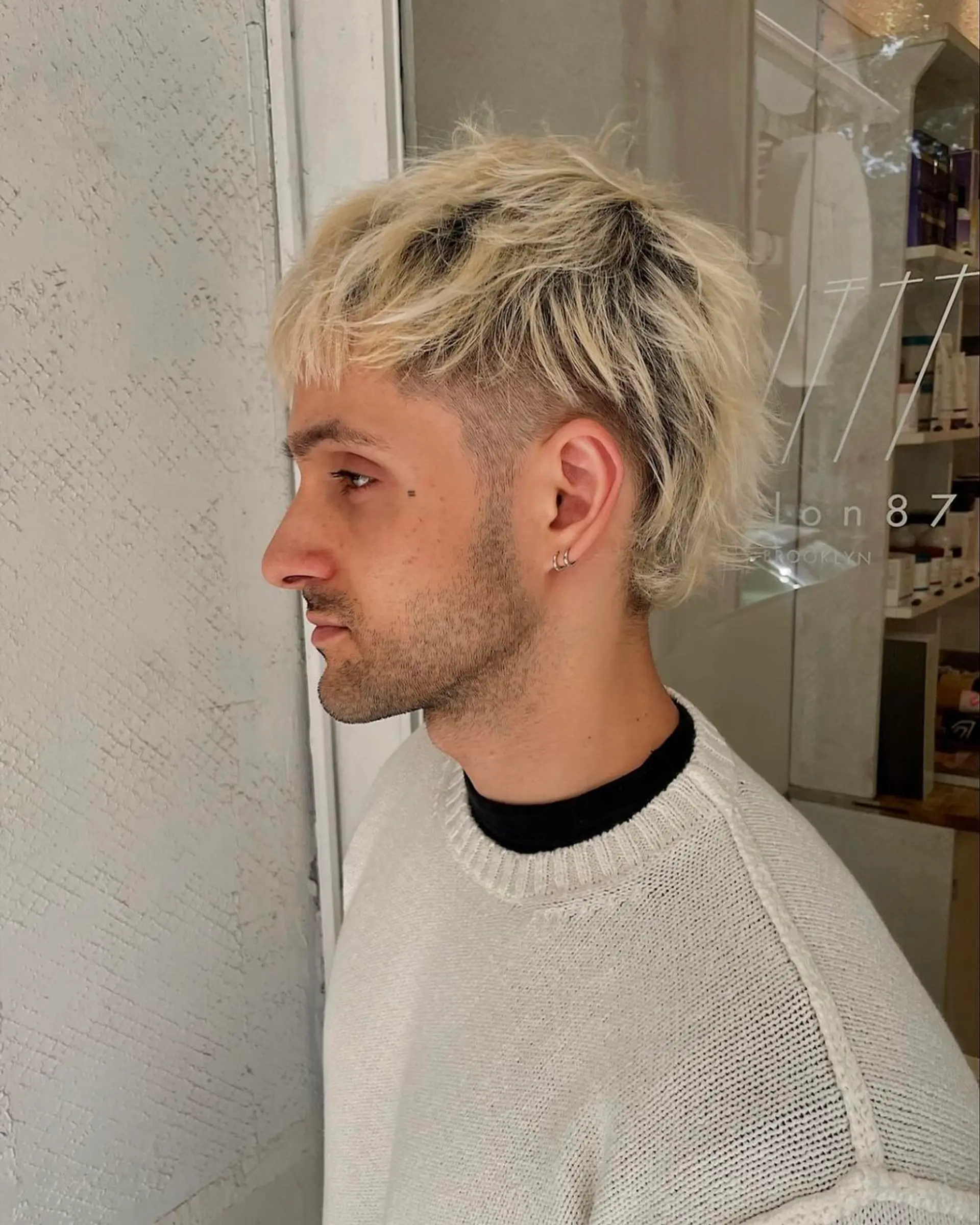 Textured layers with an undercut and faded sides, evolving into a shaggy mullet with a fringed neckline. 1