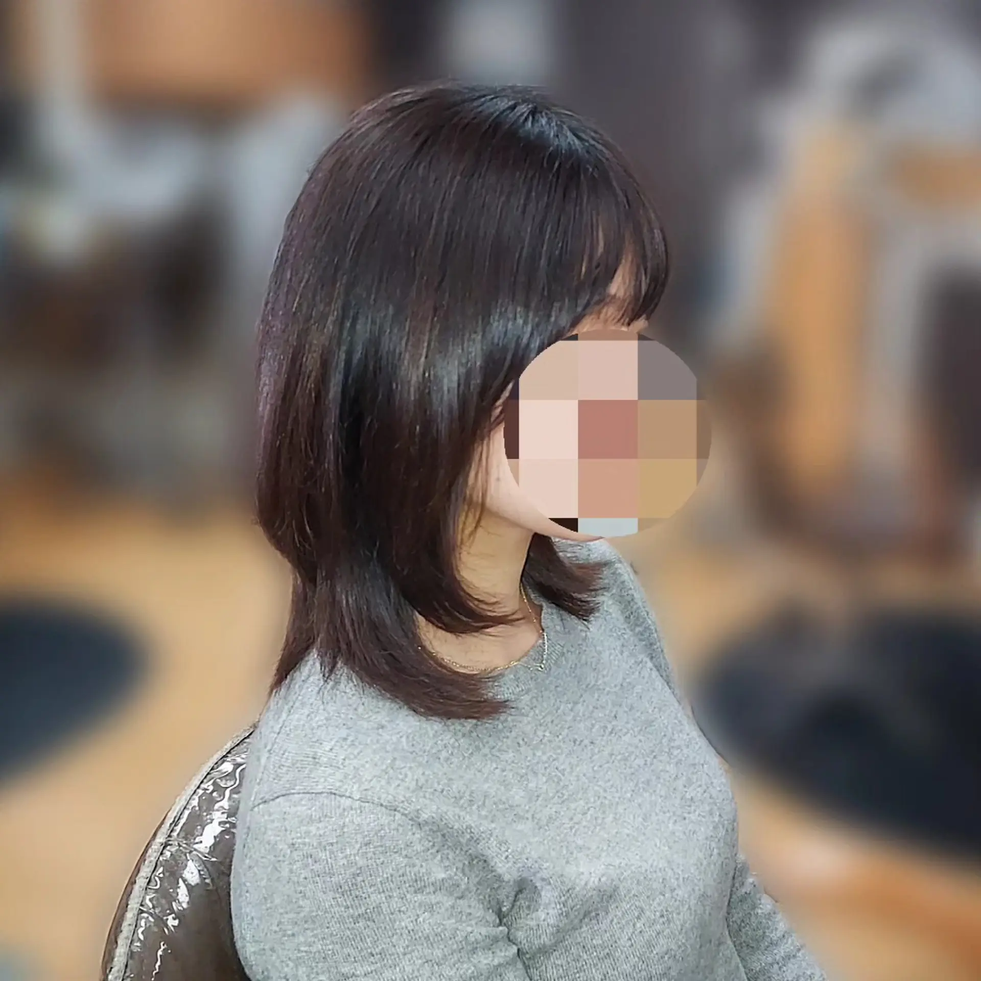 A shoulder-length layered haircut with soft inward-curving ends and light, face-framing fringe bangs. 1