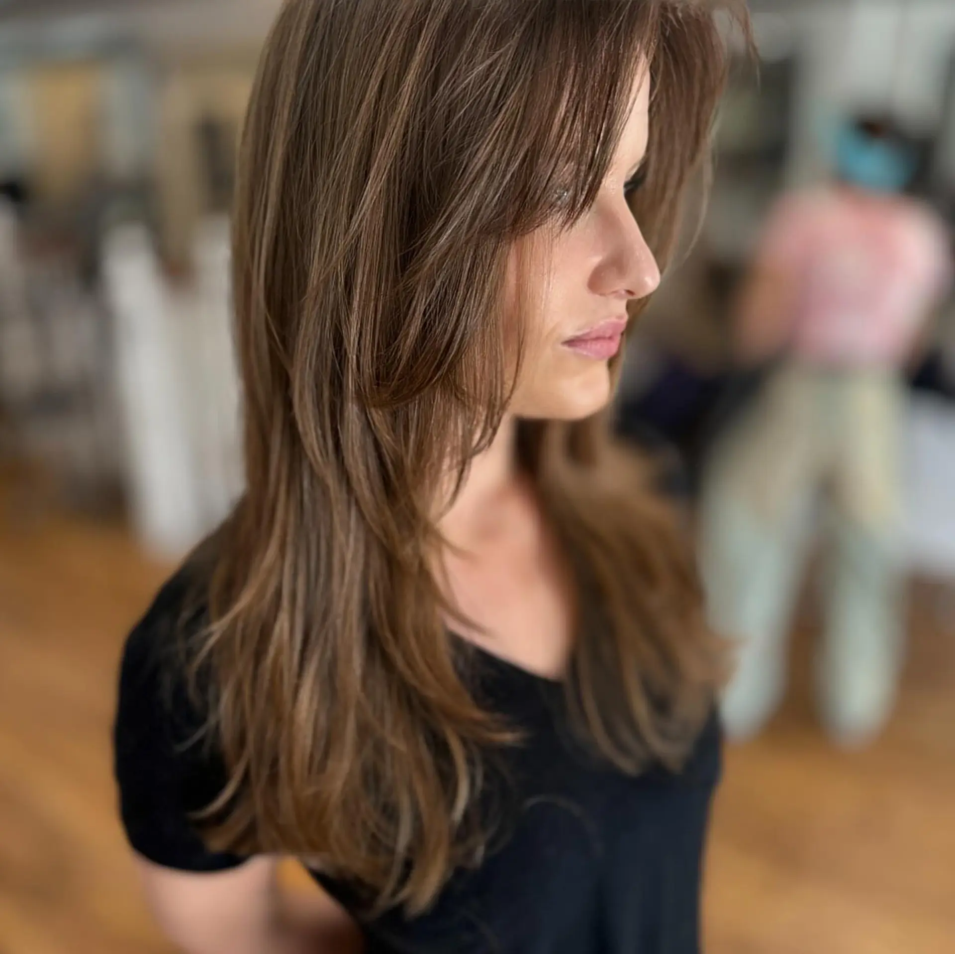 Long hair with subtle layers and face-framing pieces. 2