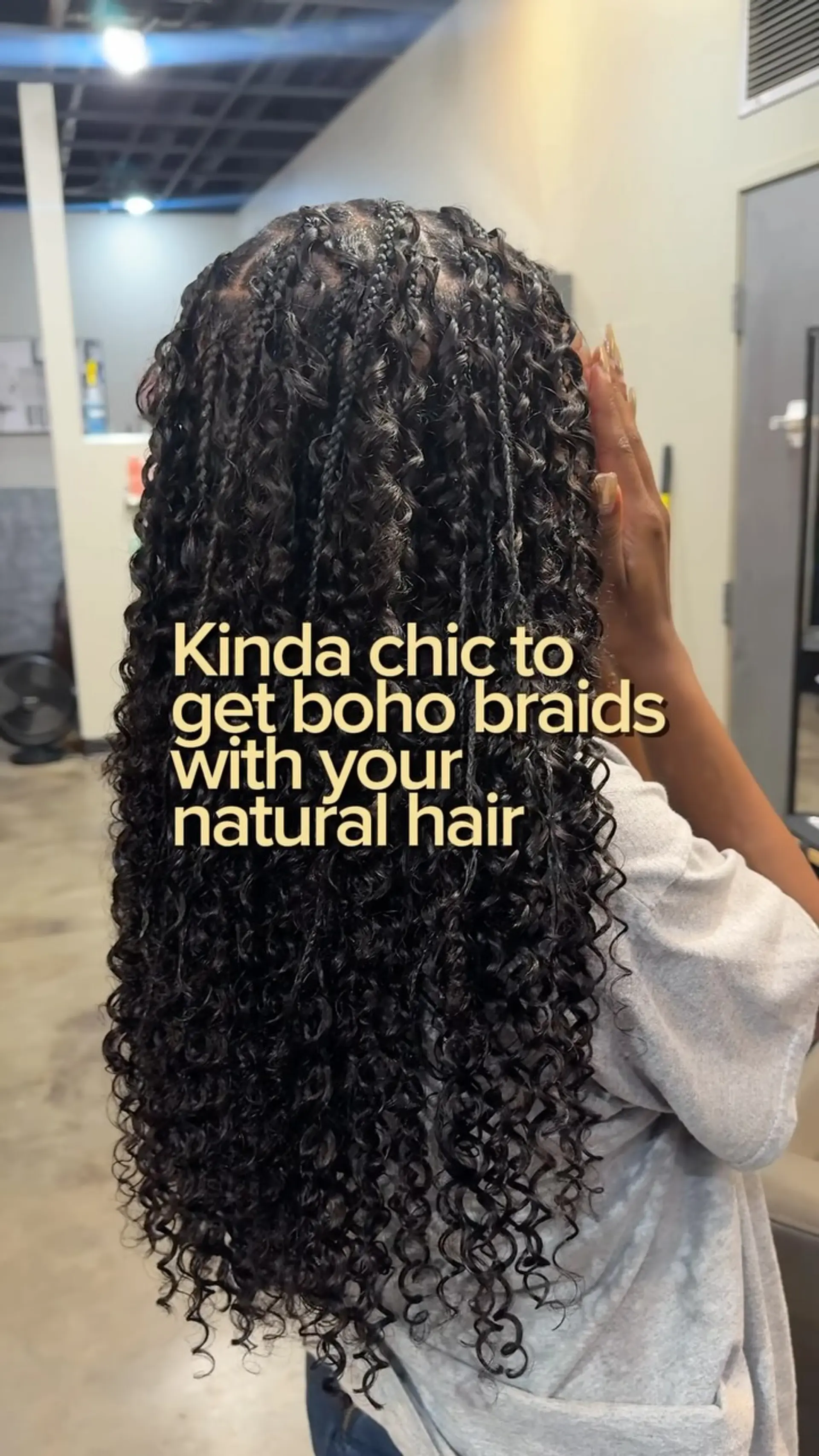 Long bohemian braids blending thin braids at the crown with cascading deep wave curls. 1
