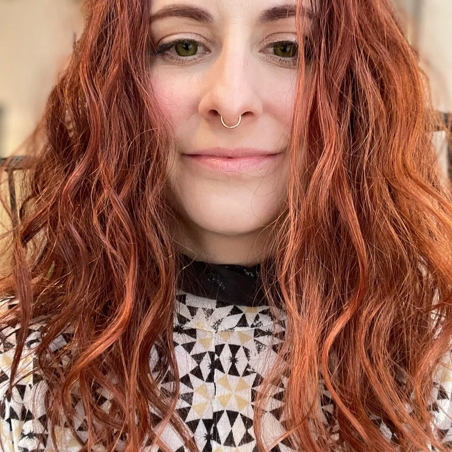 Medium-length textured waves finished with a bright peachy copper hair gloss. 1