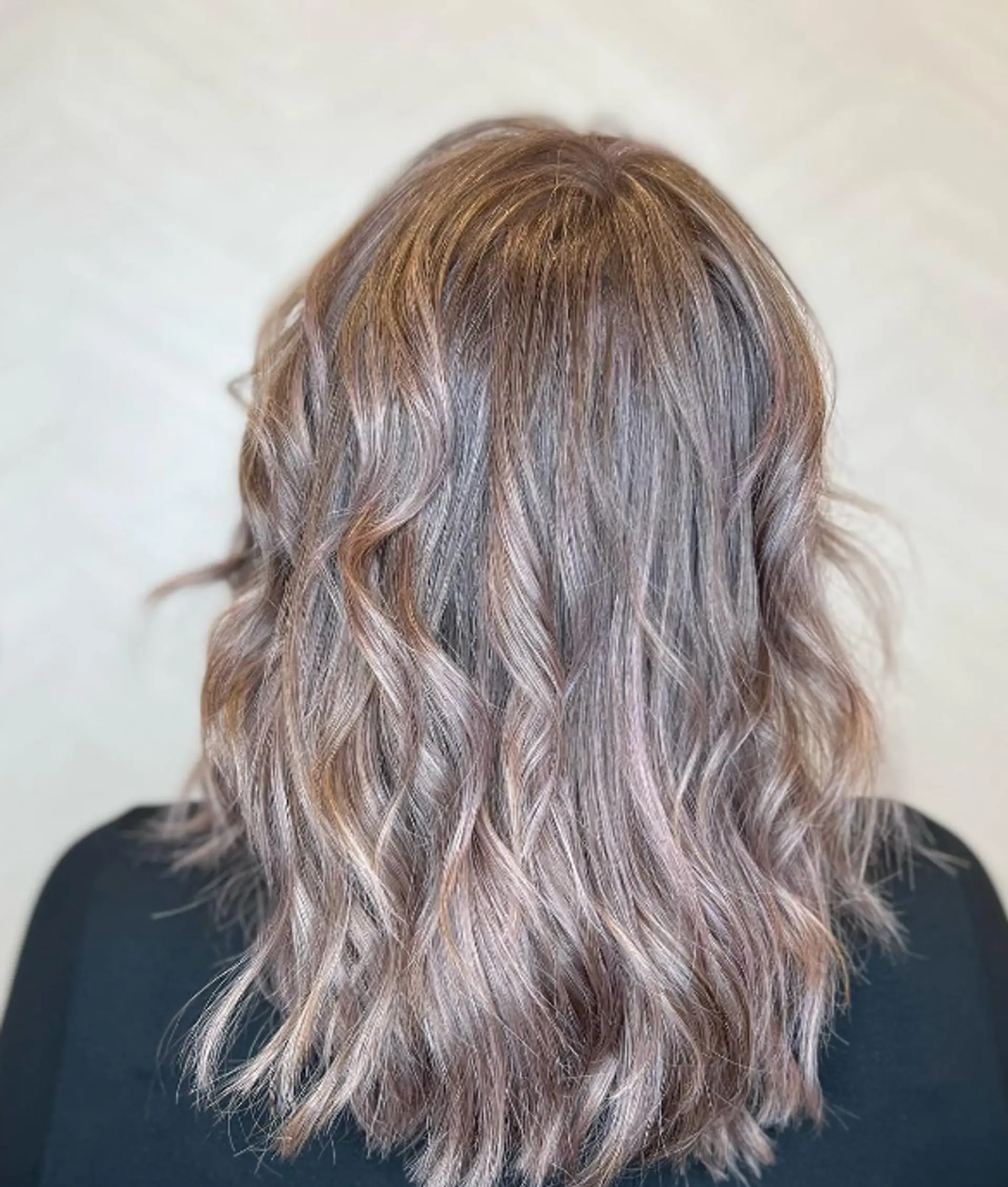 Medium-length wavy cut with tousled texture and fringe bangs in ash brown with subtle highlights.

Color by @simabeautynyc
Cut and style by @juliamannino_hair
 2