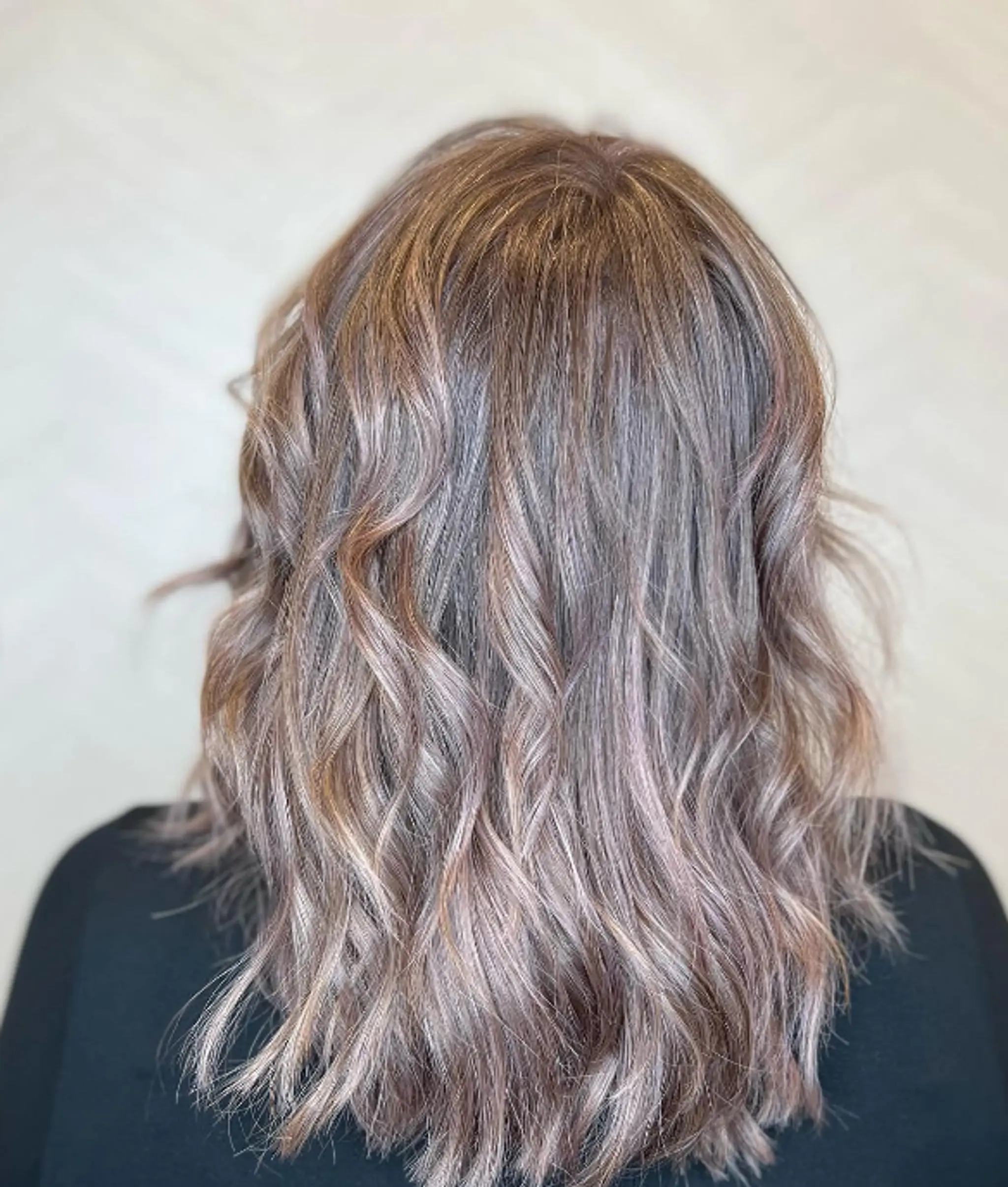 Medium-length wavy cut with tousled texture and fringe bangs in ash brown with subtle highlights.

Color by @simabeautynyc
Cut and style by @juliamannino_hair
 2