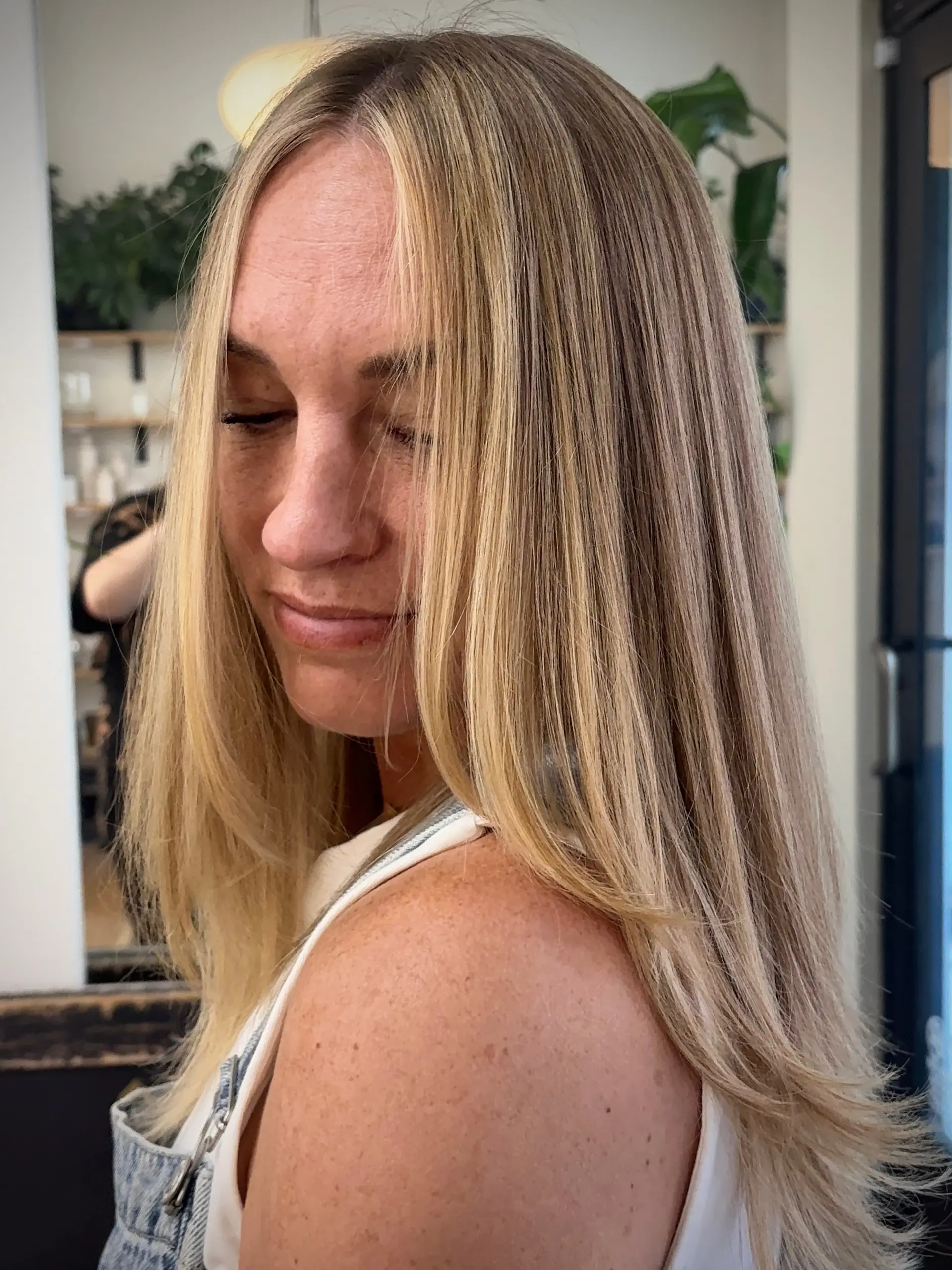 Long straight hair highlighted with warm golden blonde tones, featuring a seamless shadow root and a bright face-framing money piece. 1