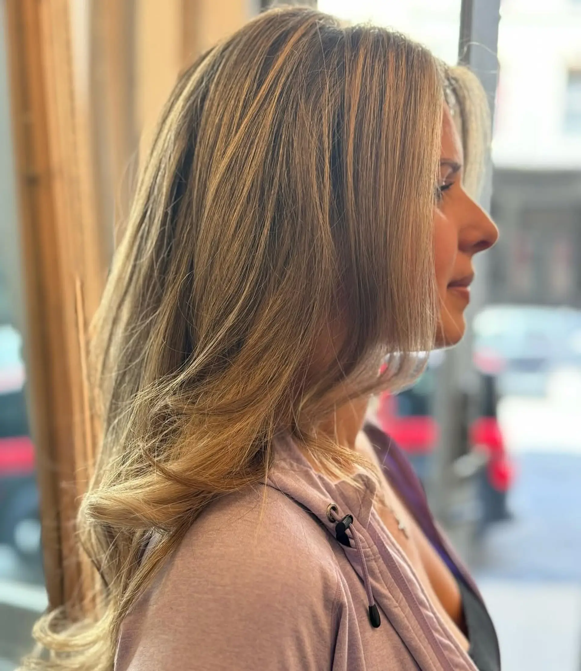 Long, wavy blonde hair with natural highlights, featuring soft, loose waves and layered dimensions. 2