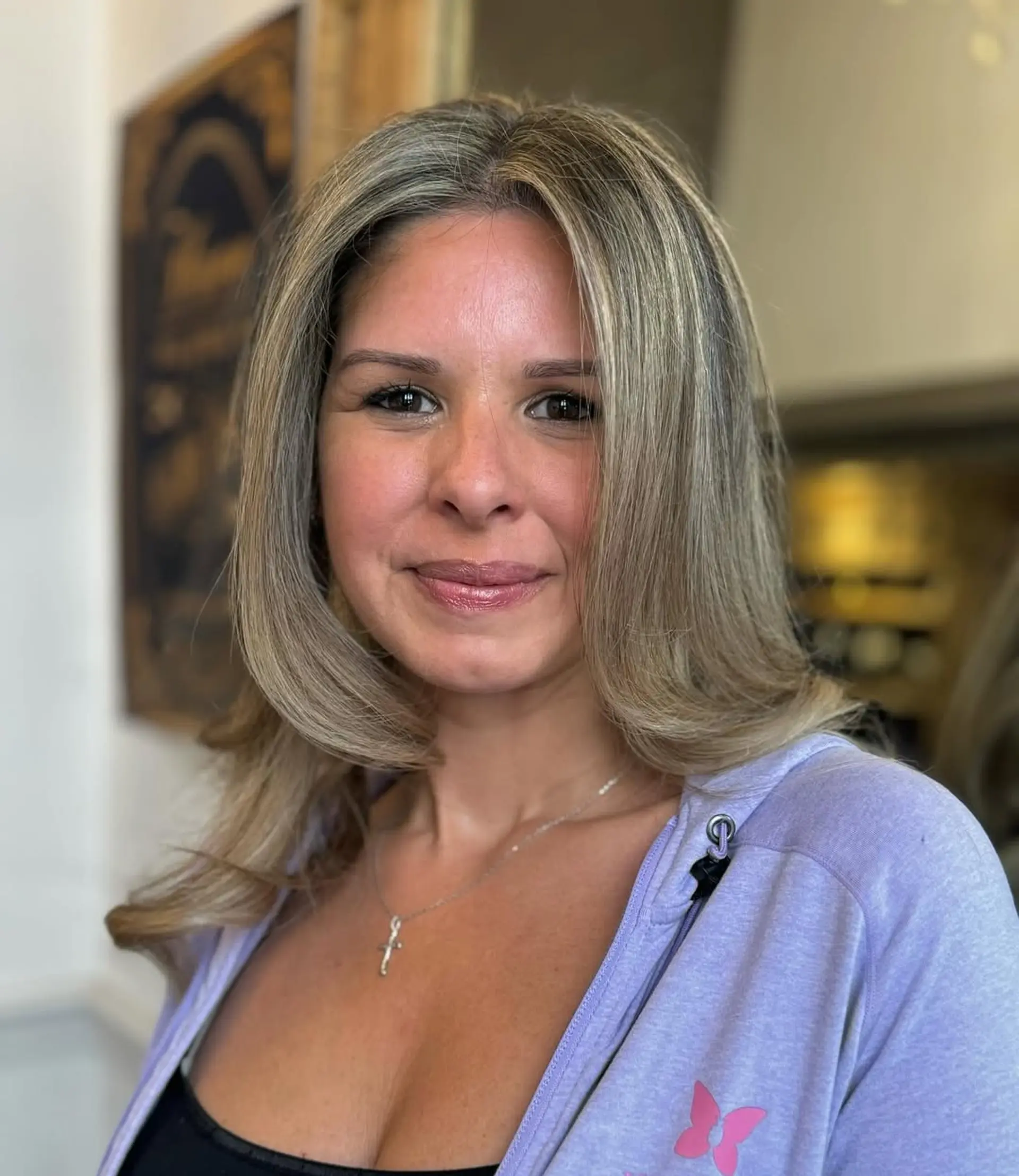 Long, wavy blonde hair with natural highlights, featuring soft, loose waves and layered dimensions. 3