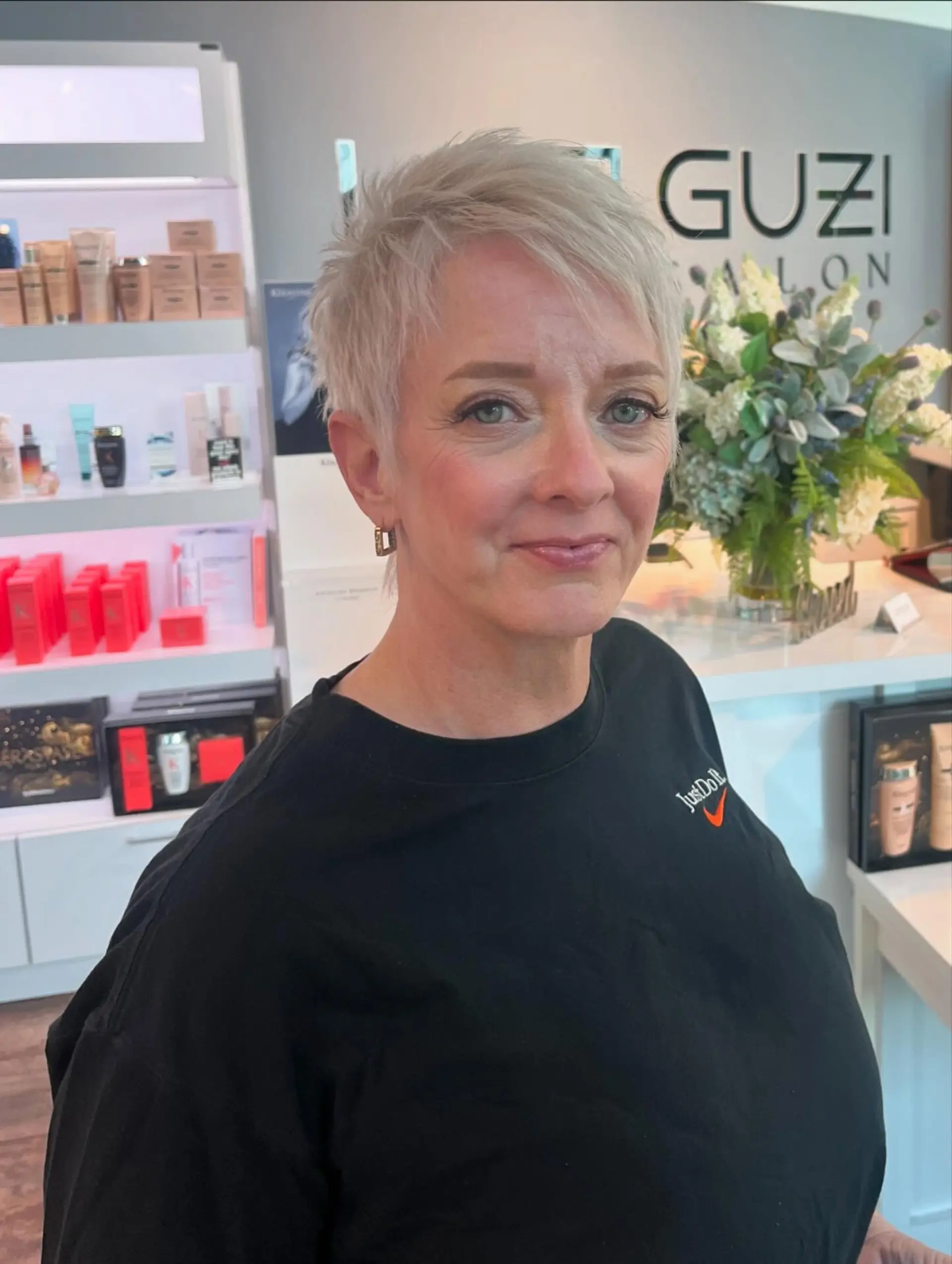 A short, textured pixie cut with a layered effect. 3