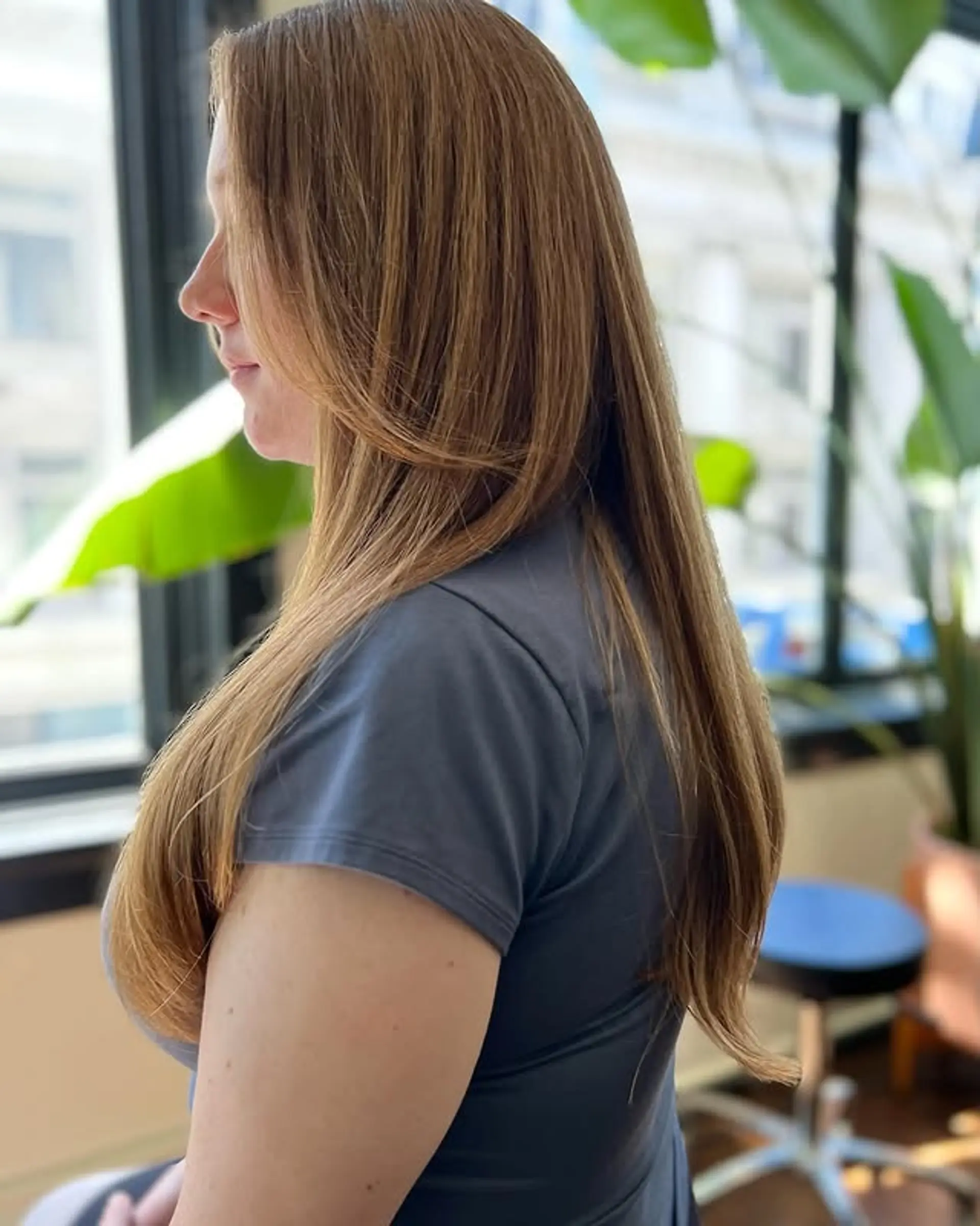 Long, light brunette hairstyle with long layers and face-framing details. 1