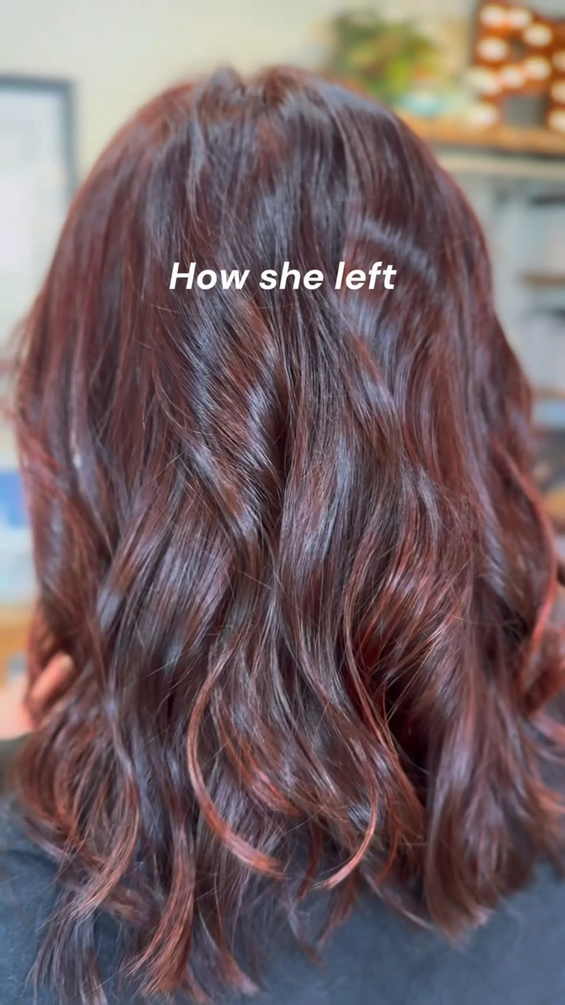 Medium-length hair colored in a deep wine red tone styled into soft, glossy textured waves. 1