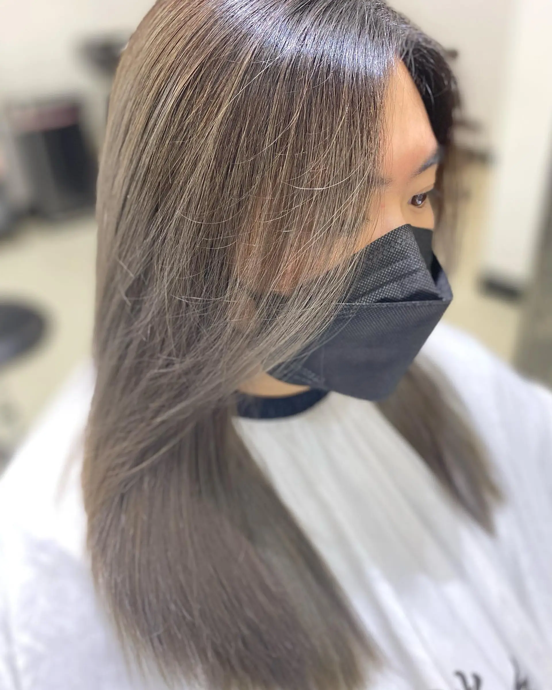 Long, straight hair with a sleek ash brown color. 1