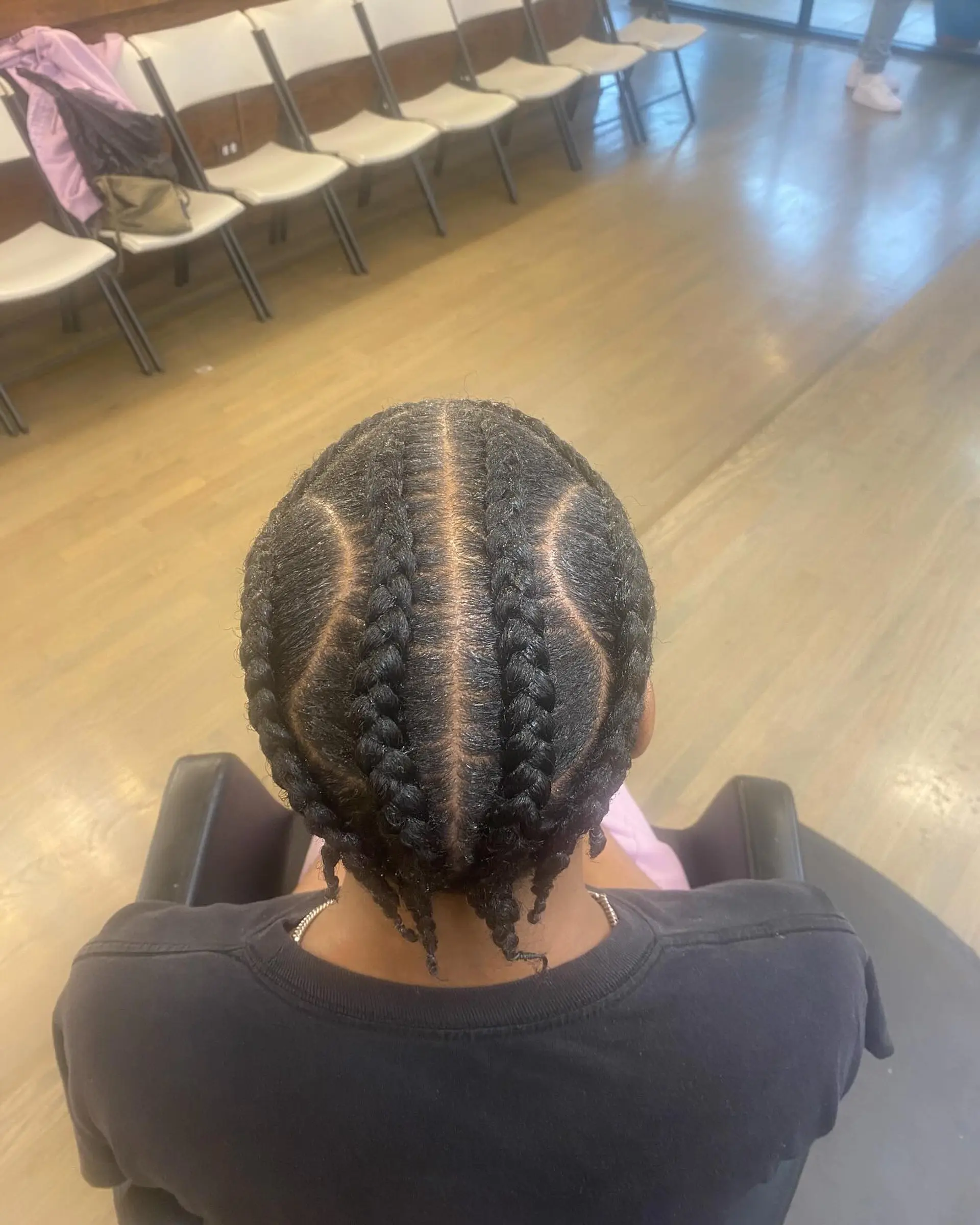 Intricate braids with a clean fade for a modern men's look. 3