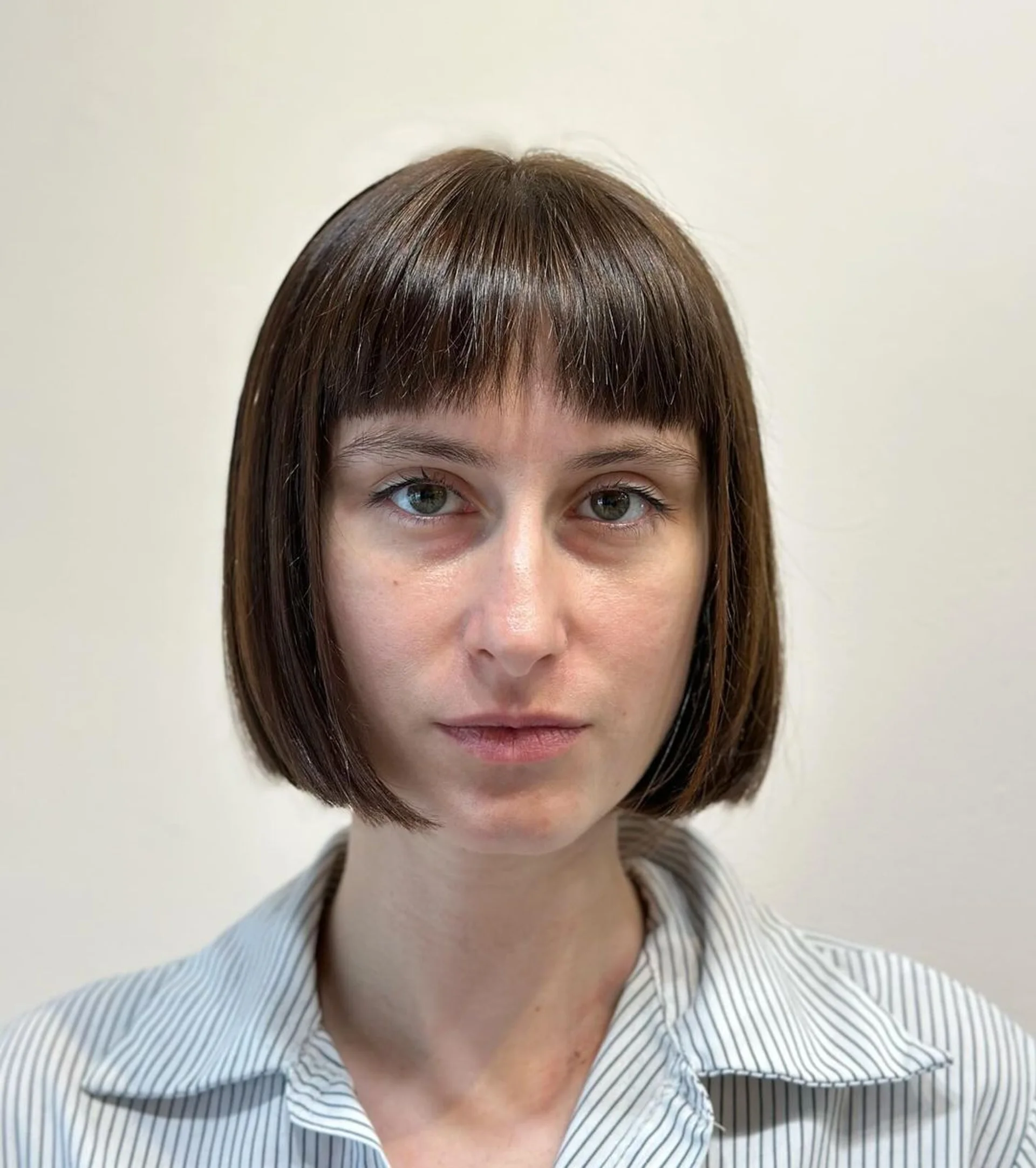 Vibrant tangerine blunt bob with statement bangs - Preview 1