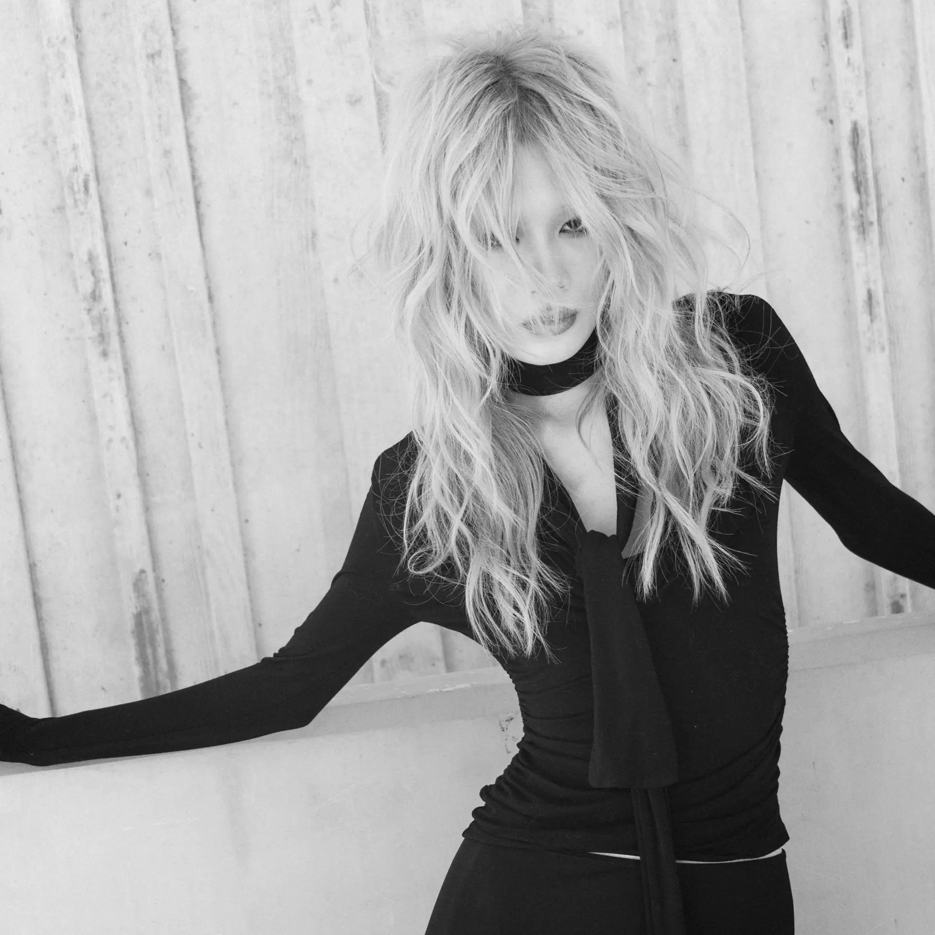A heavily layered shag haircut with messy, textured waves and face-framing fringe. 1