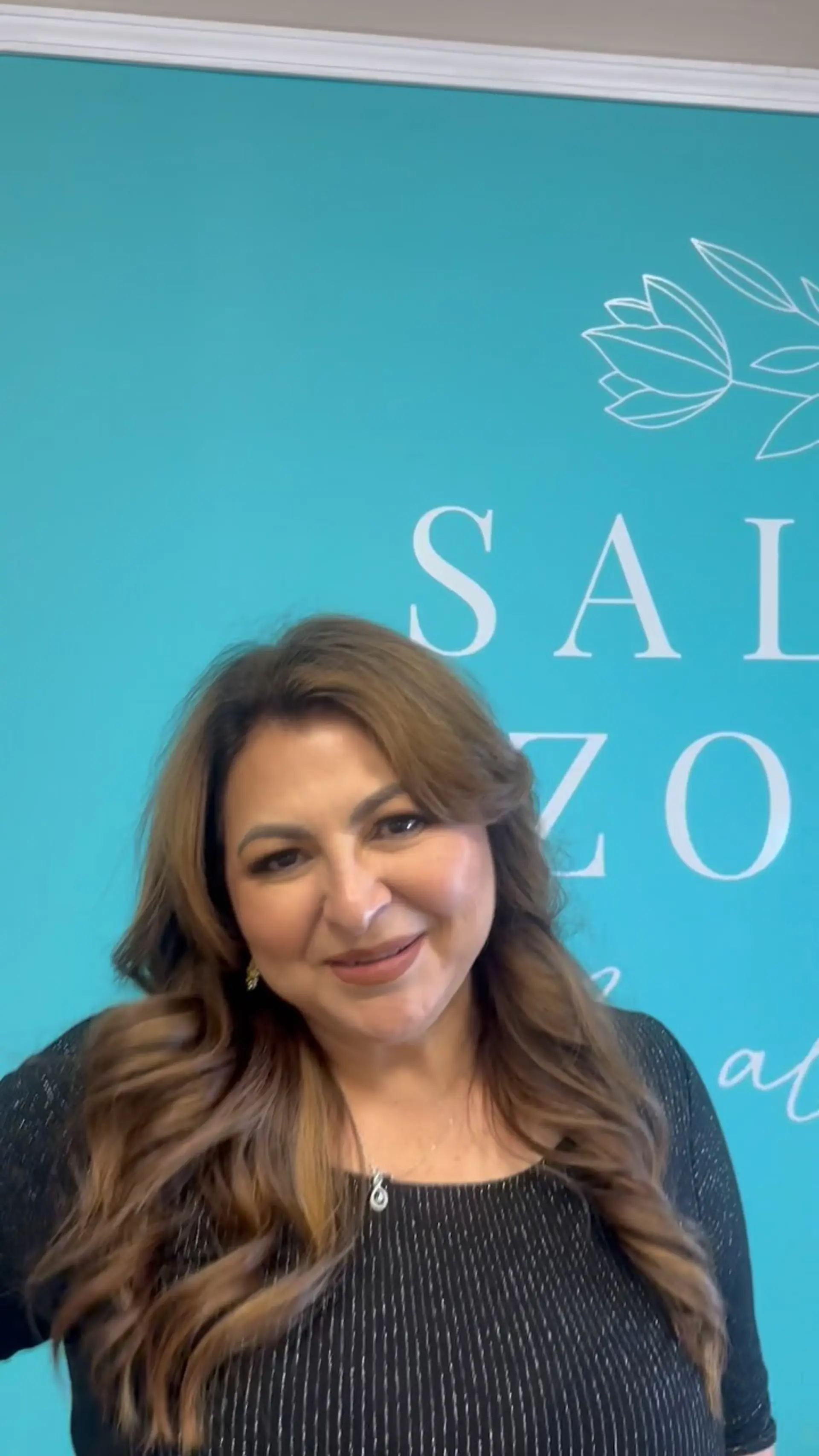A glamorous, voluminous blowout styled with soft, cascading waves. 1