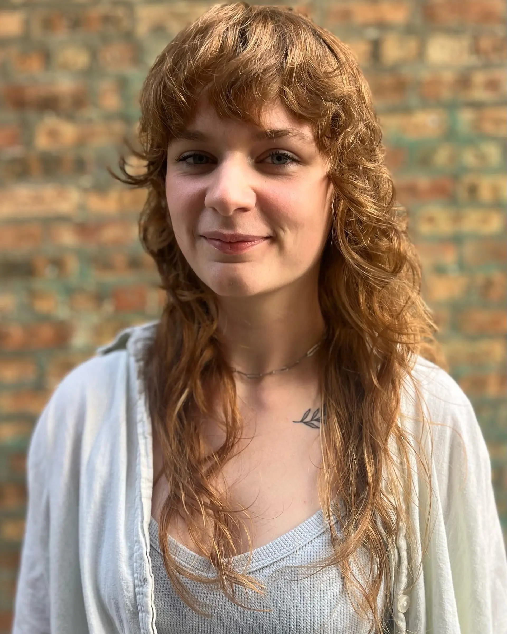 A trendy shag mullet with textured layers and wispy bangs. 1