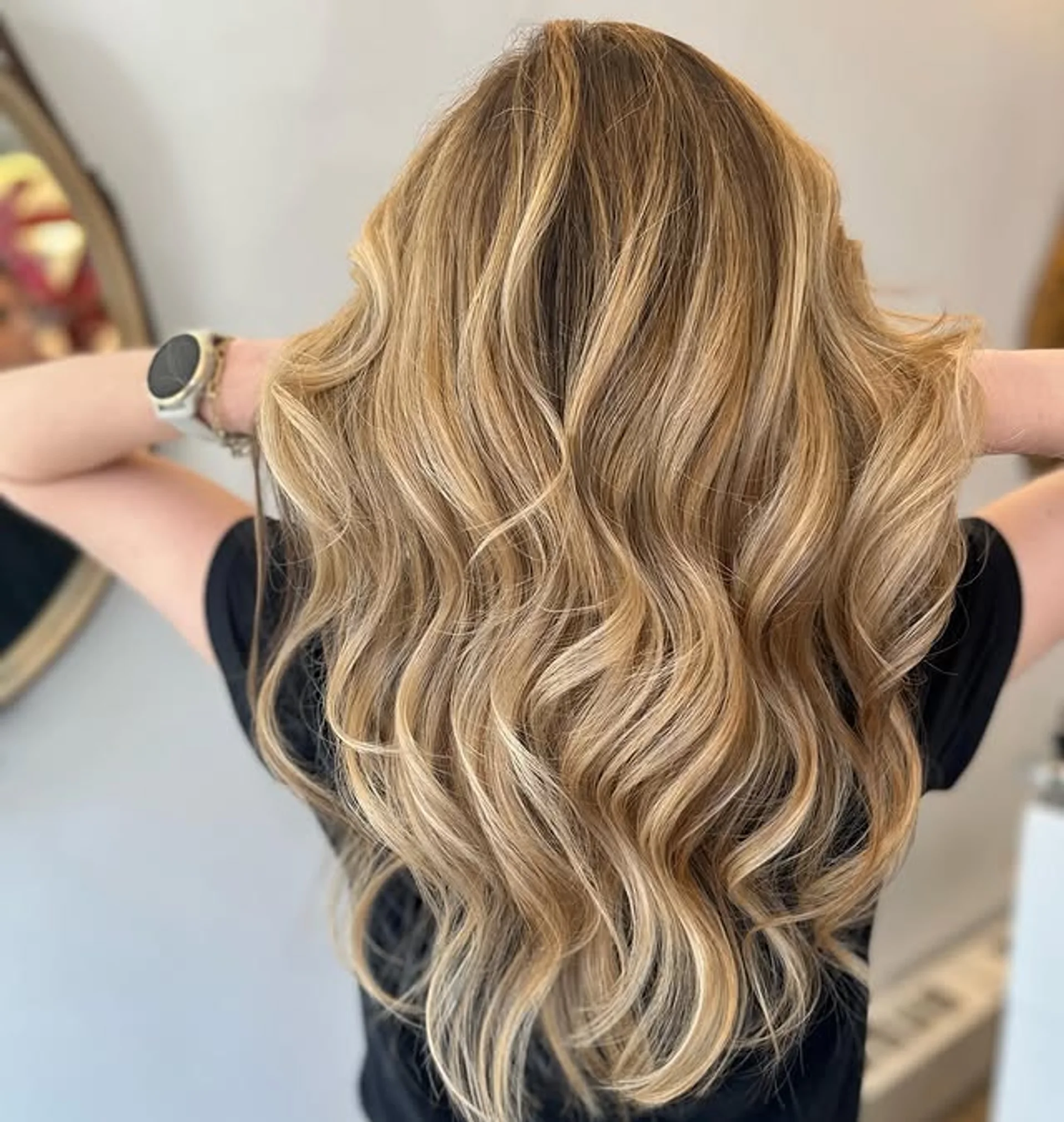 Soft, medium-length wavy hairstyle with natural blonde tones and a subtle side part, exuding a sun-kissed elegance perfect for the Hamptons. - Preview 2