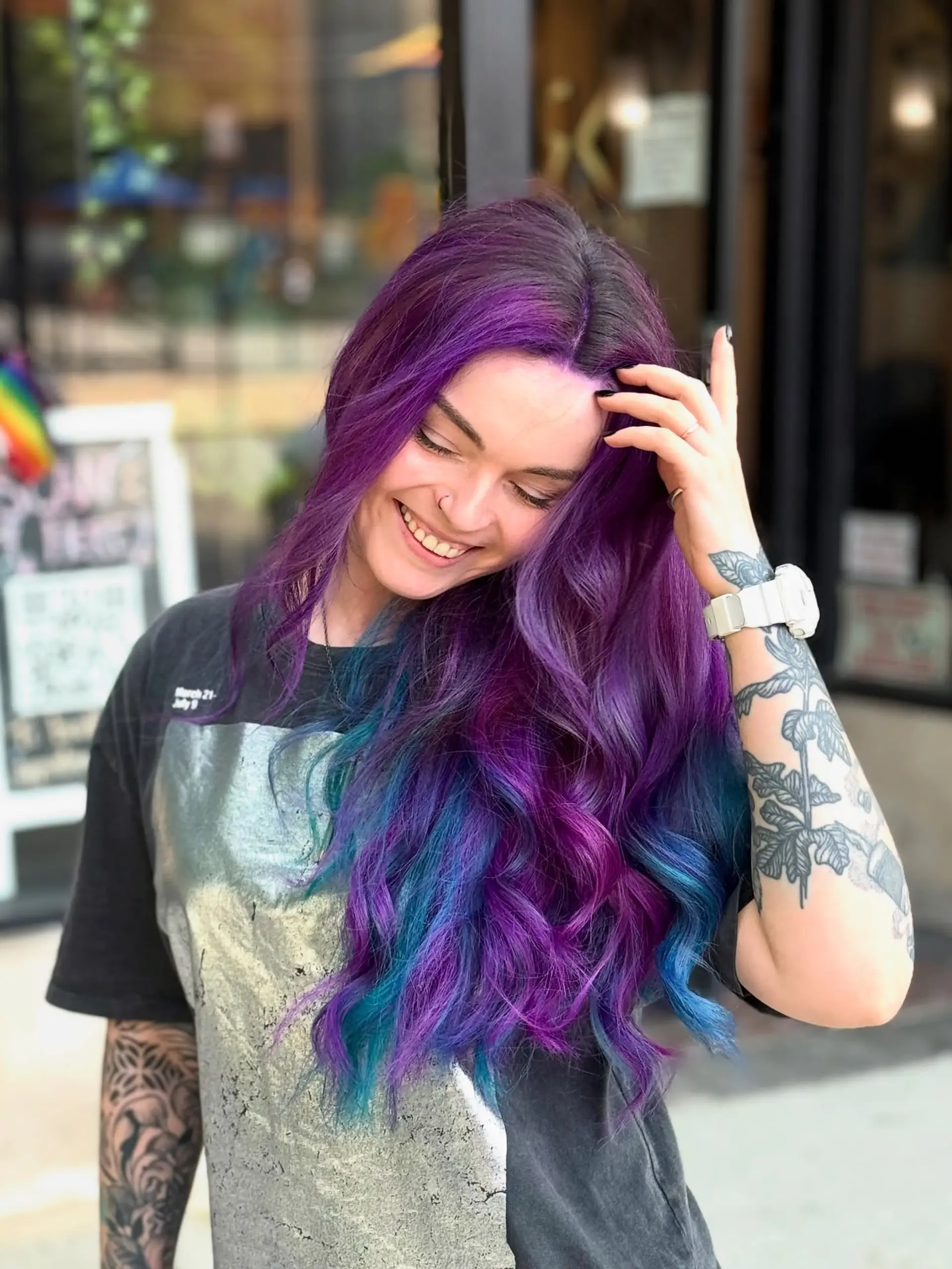 Vibrant purple and teal wavy hair styled with soft, loose dimension and movement. 1