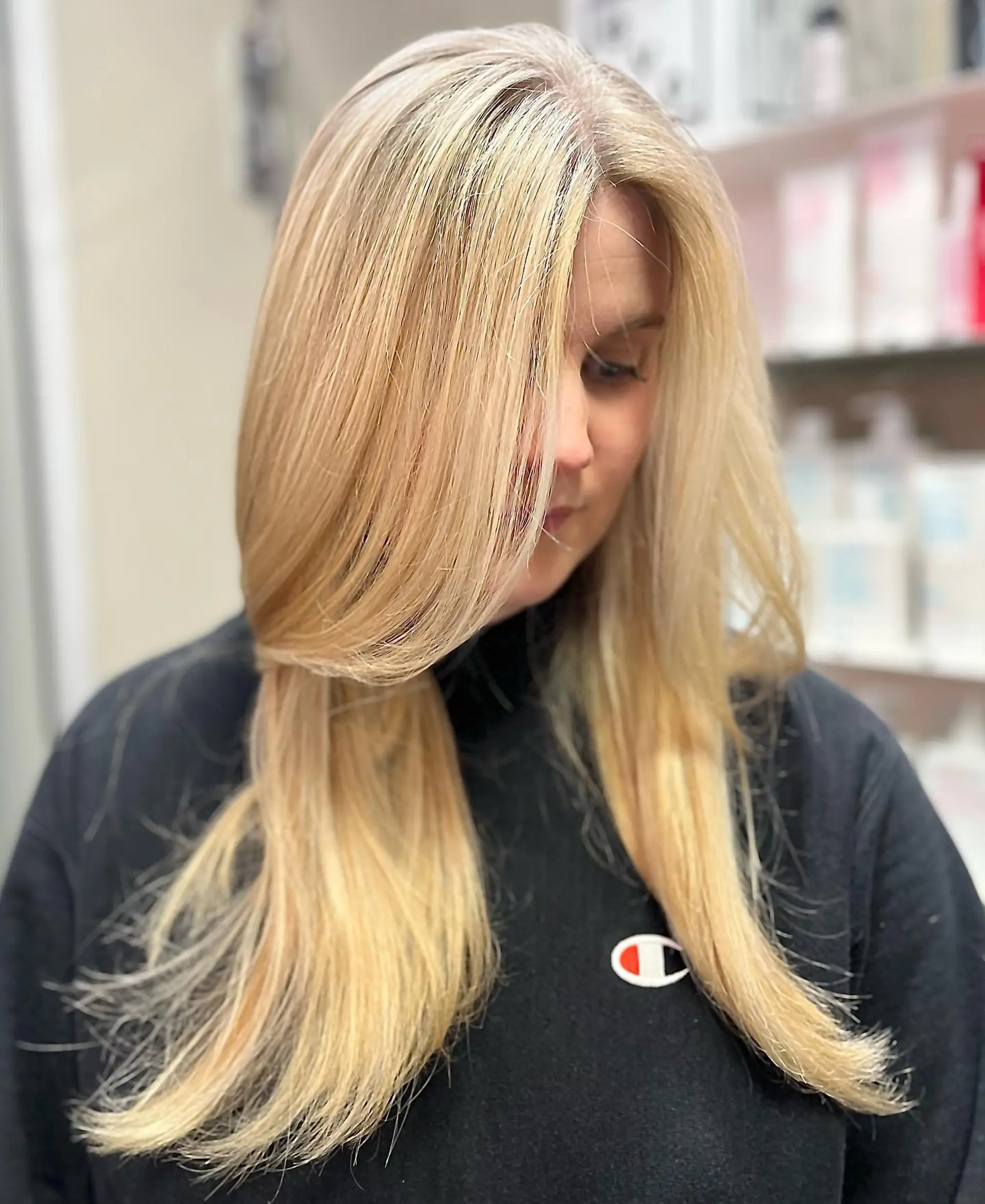 A long, layered haircut with face-framing pieces. The hair is primarily honey blonde with ashy blonde highlights. 1