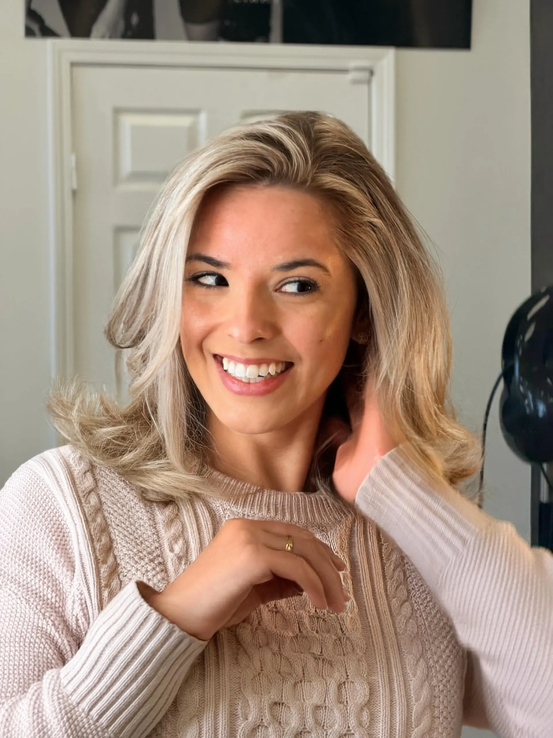 A layered, medium-length blowout with voluminous face-framing layers and soft flicked ends. 1