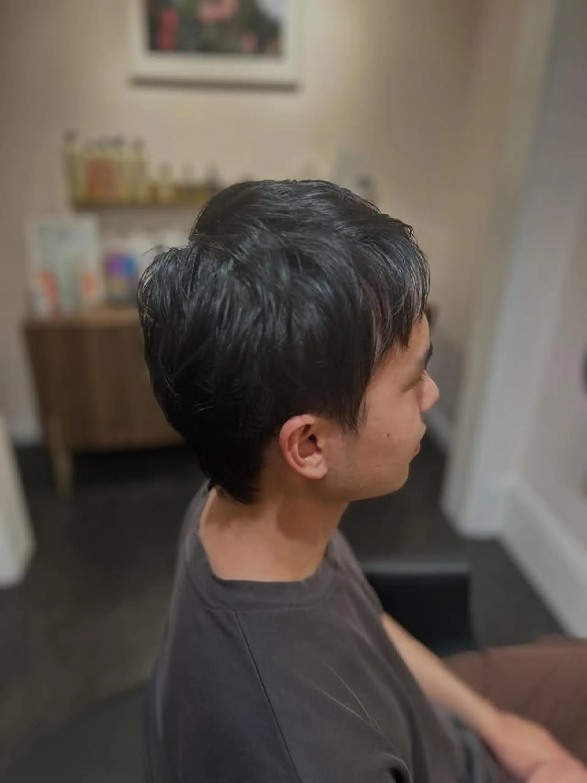 This is a trendy short, textured messy crop with a side-swept top and neatly tapered sides. The style emphasizes natural movement and volume, giving a relaxed yet fashionable appearance. 1