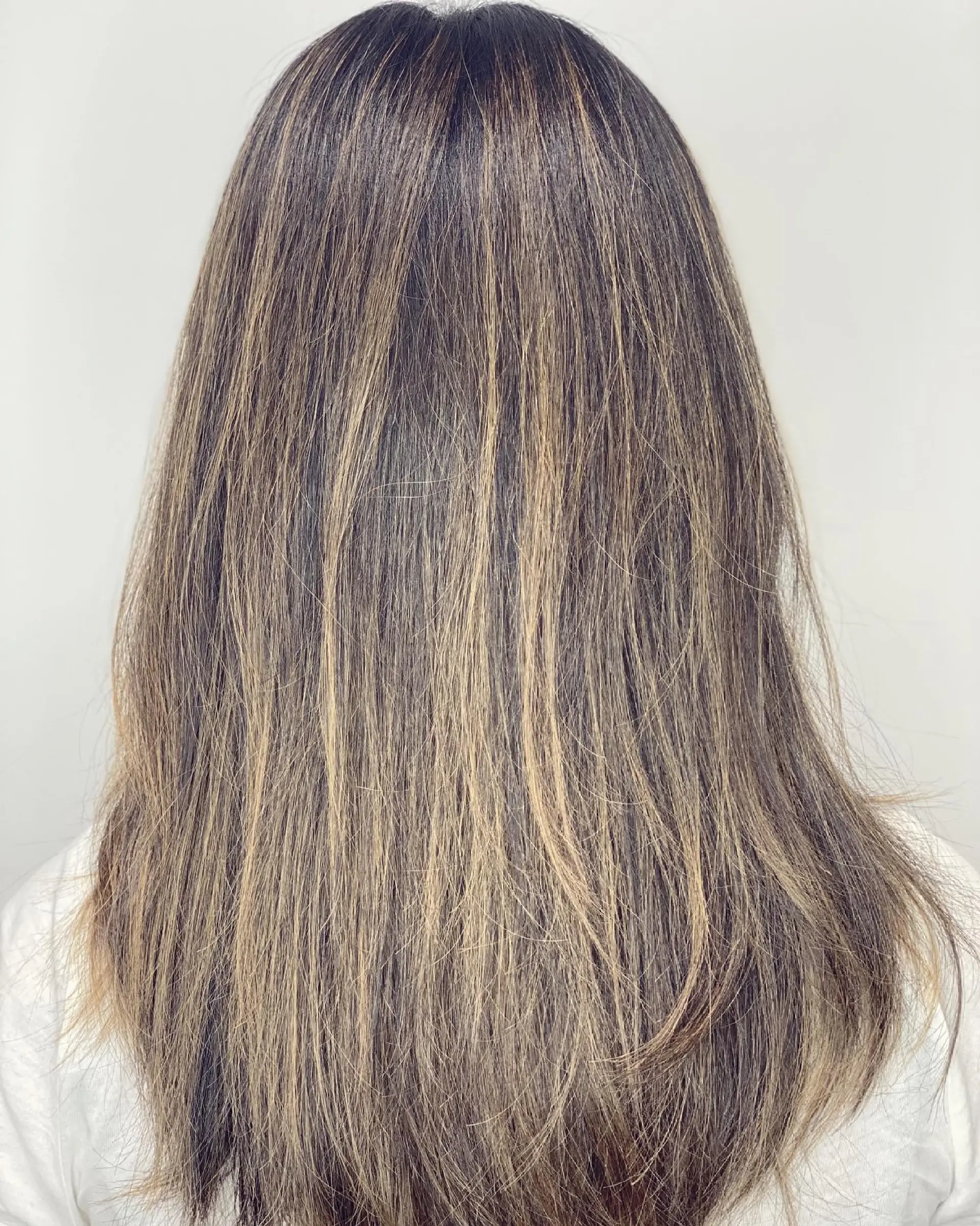 Long, straight hair with a bronde balayage and face-framing layers. 1