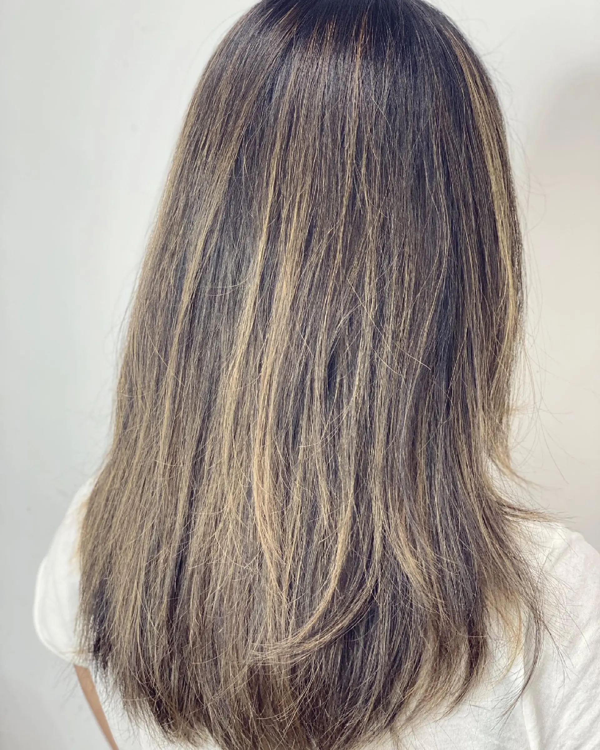 Long, straight hair with a bronde balayage and face-framing layers. 2