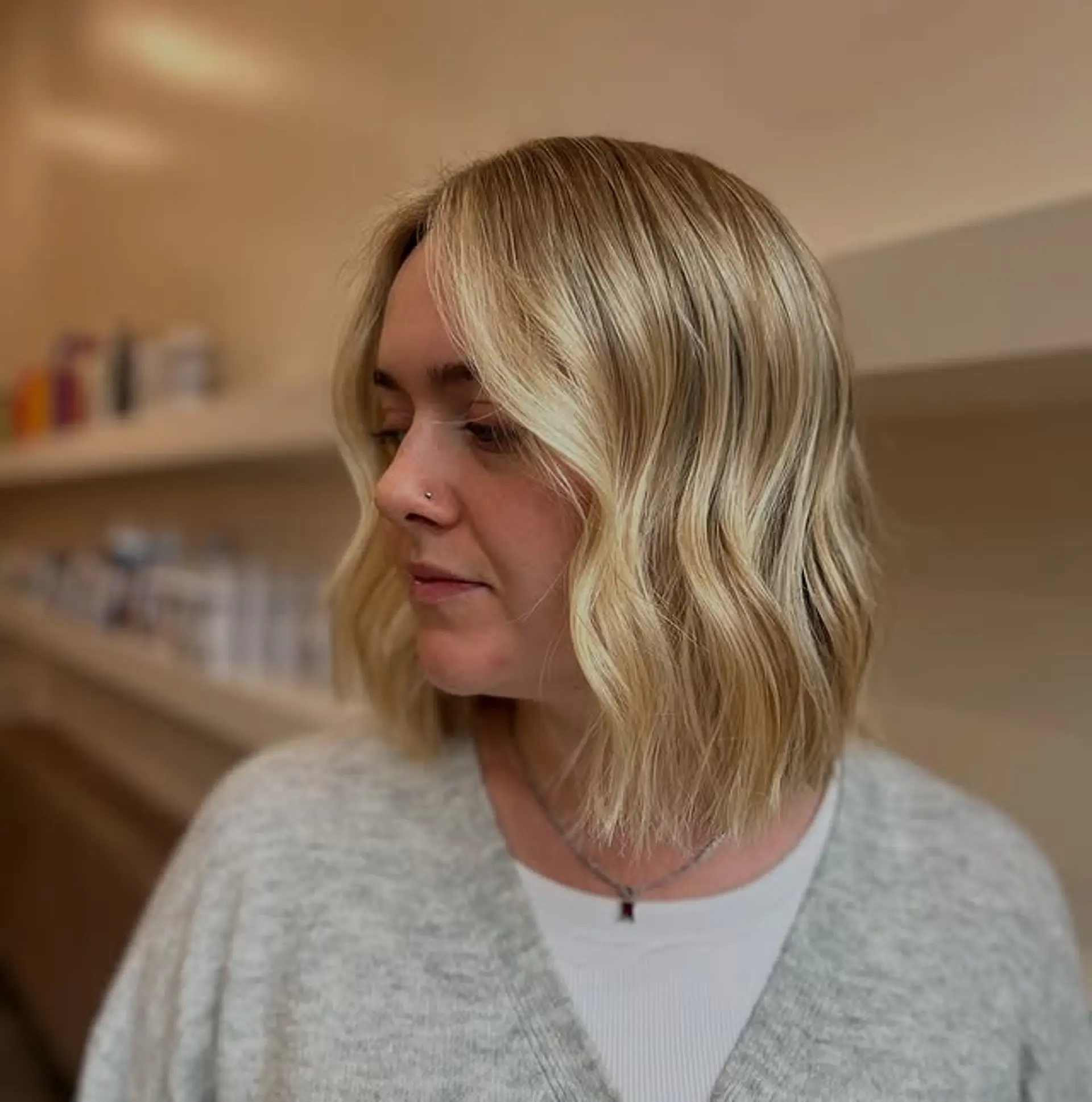 A chic shoulder-length lob with soft, beachy waves and face-framing layers to accentuate the features. 1