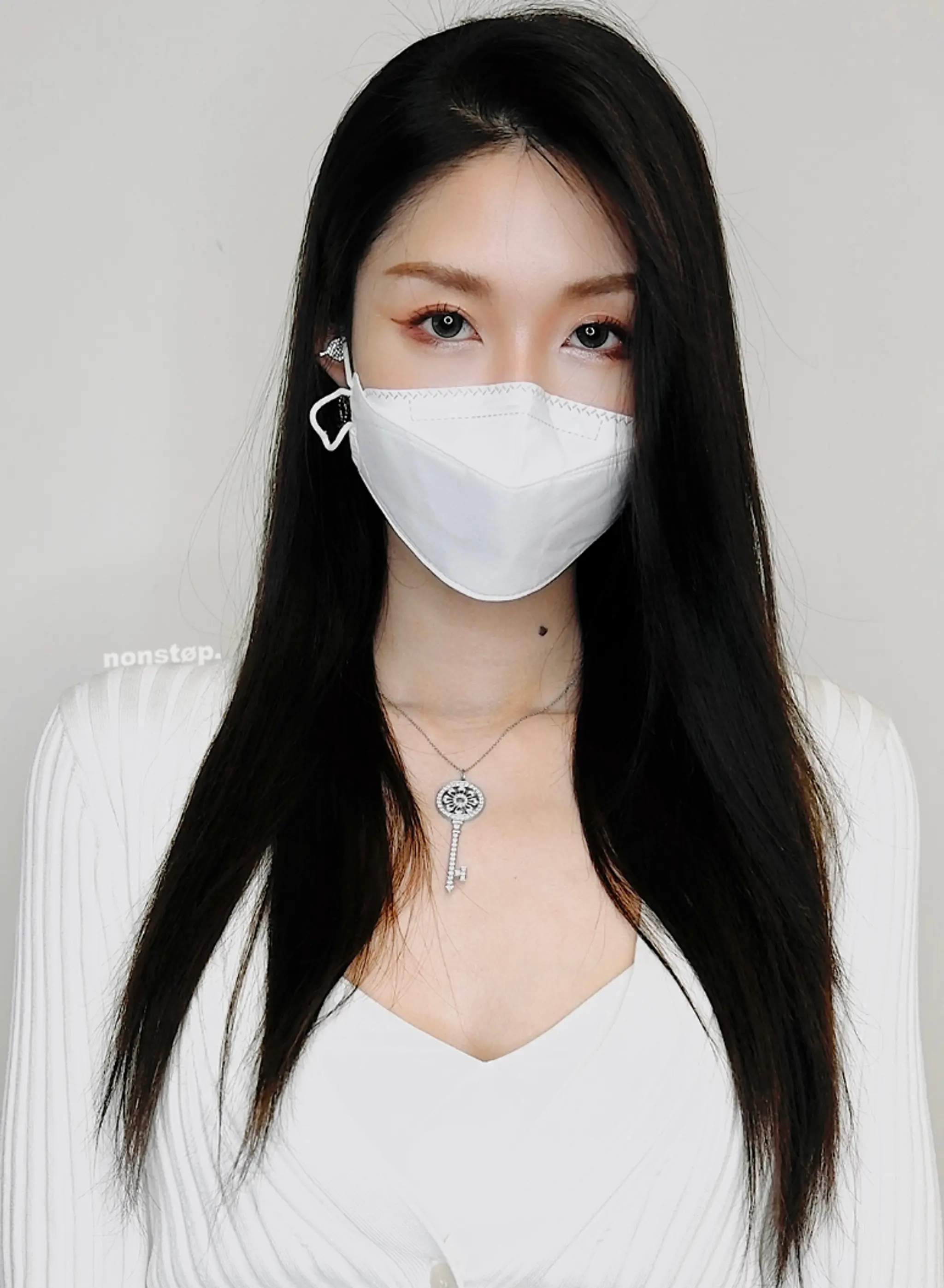 A sleek and glossy long hairdo with straight, well-maintained strands, featuring a middle part and subtle layering at the ends for added movement and dimension.

(NonstopStyle: by Neil)