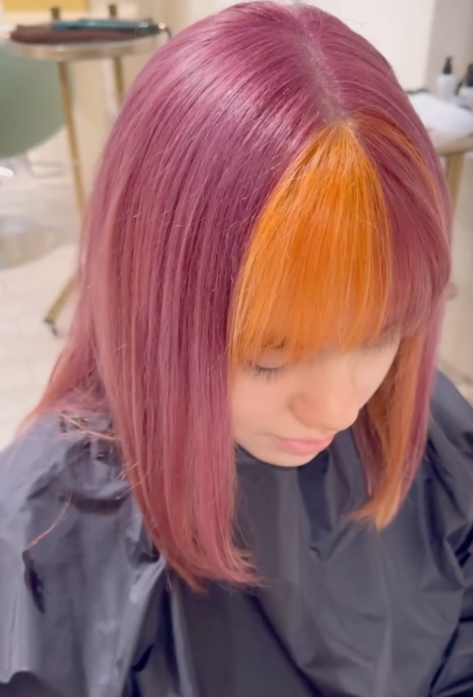 Medium length straight hair with bold purple and orange colors, side part, and blunt bangs.


Stylist: @yurihair.newyork 2