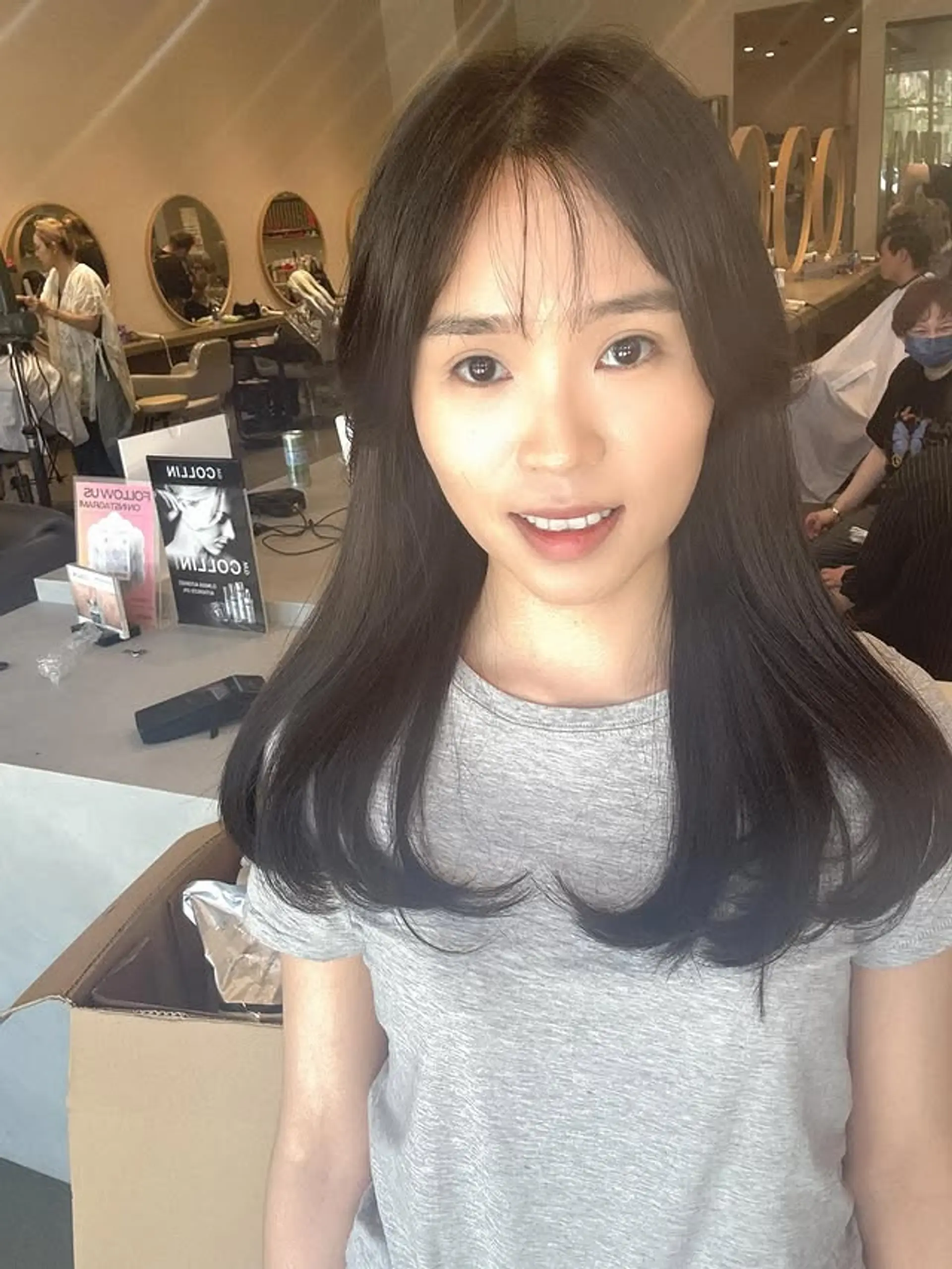 A long layered cut with curtain bangs. 1