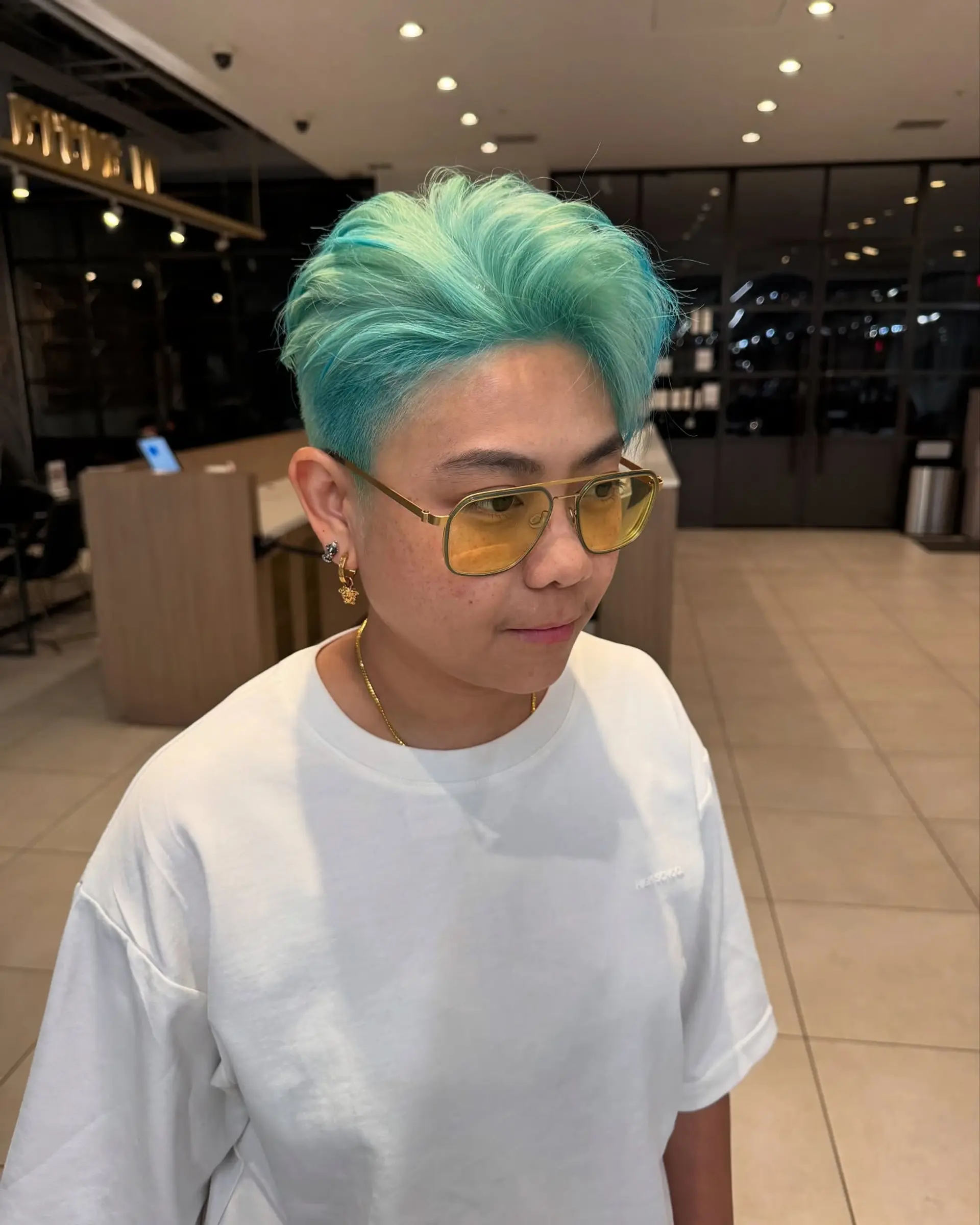 Short pixie cut with vibrant turquoise ombre. 1