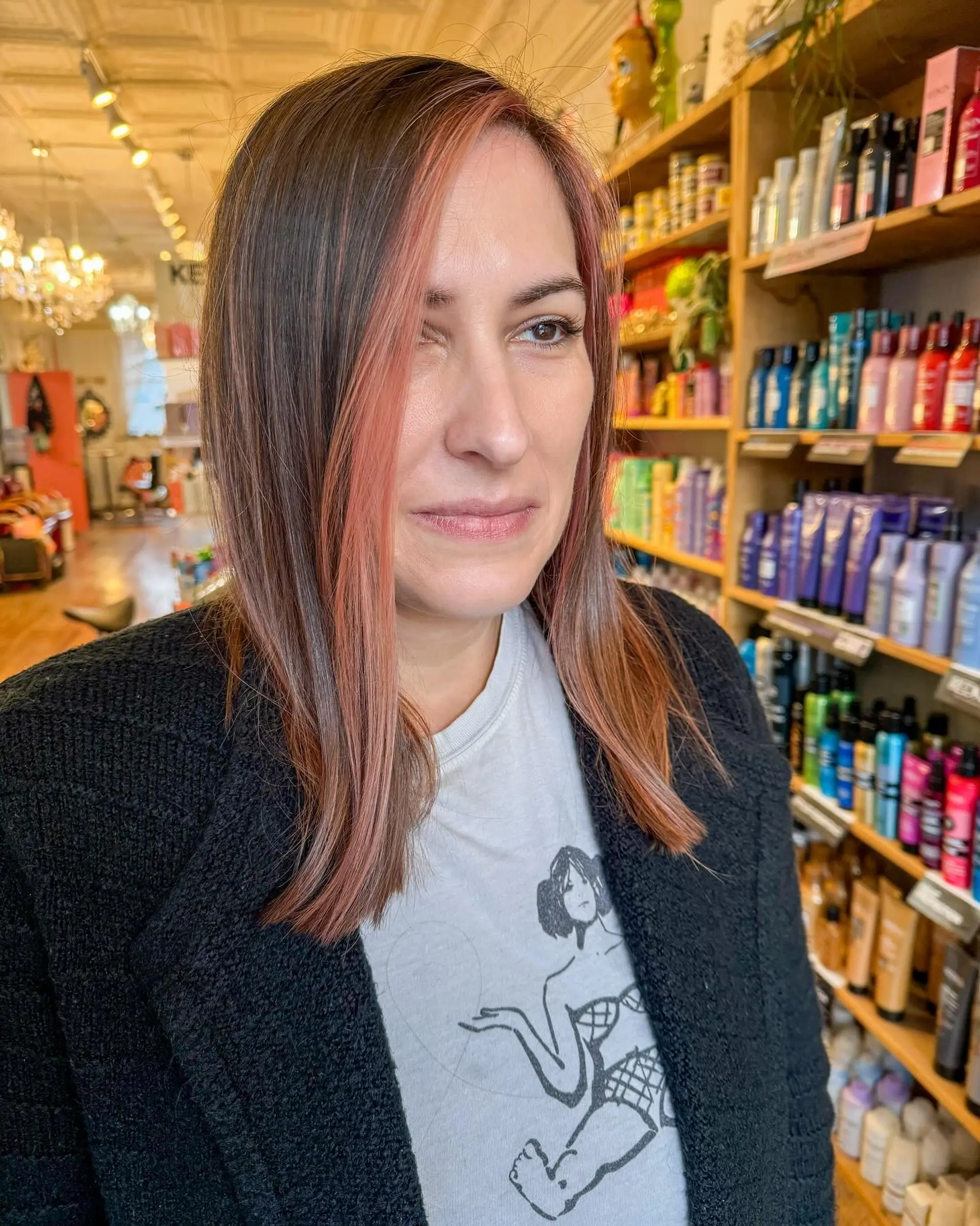 A chic medium-length lob with face-framing rose gold highlights. 1