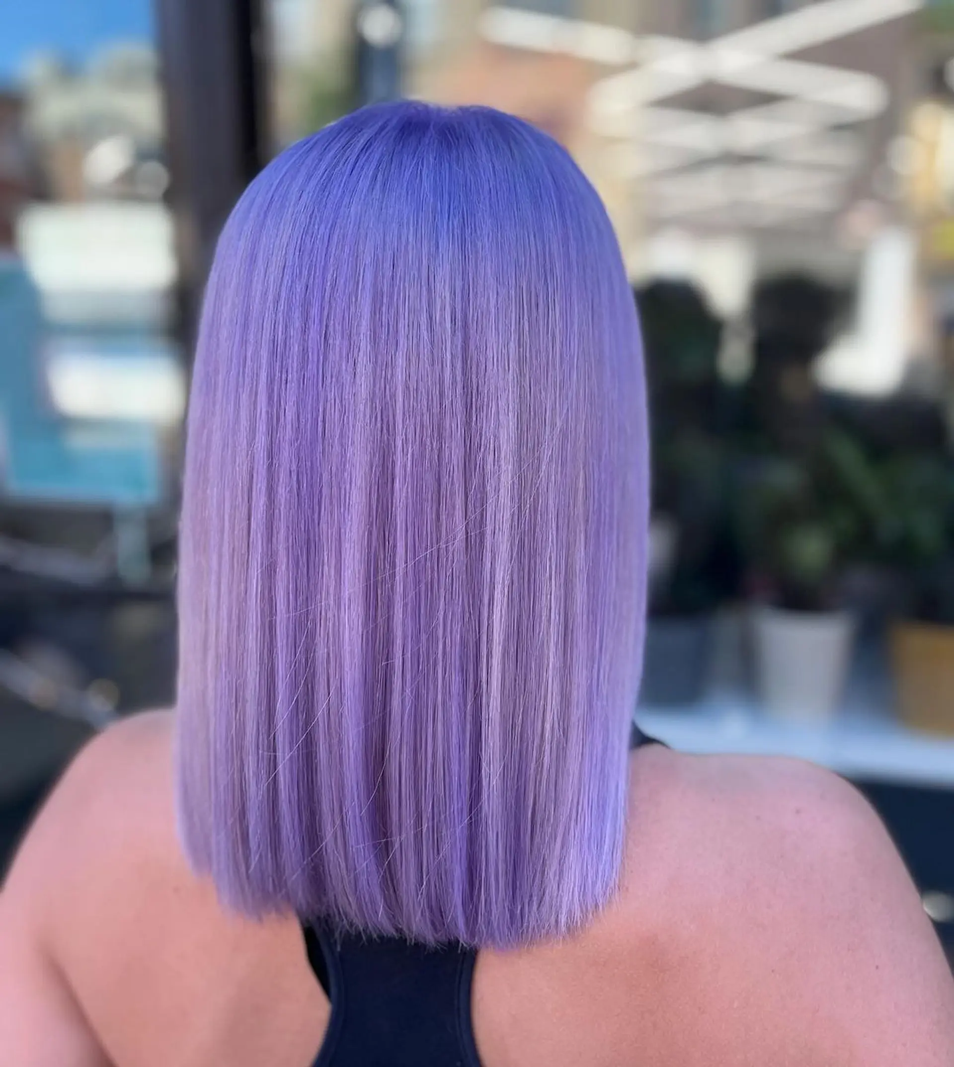 A medium-length, sleek, and straight hairstyle with a vibrant purple color, featuring a blunt cut and a smooth, polished finish.
Stylist - @xcellent_jason 1