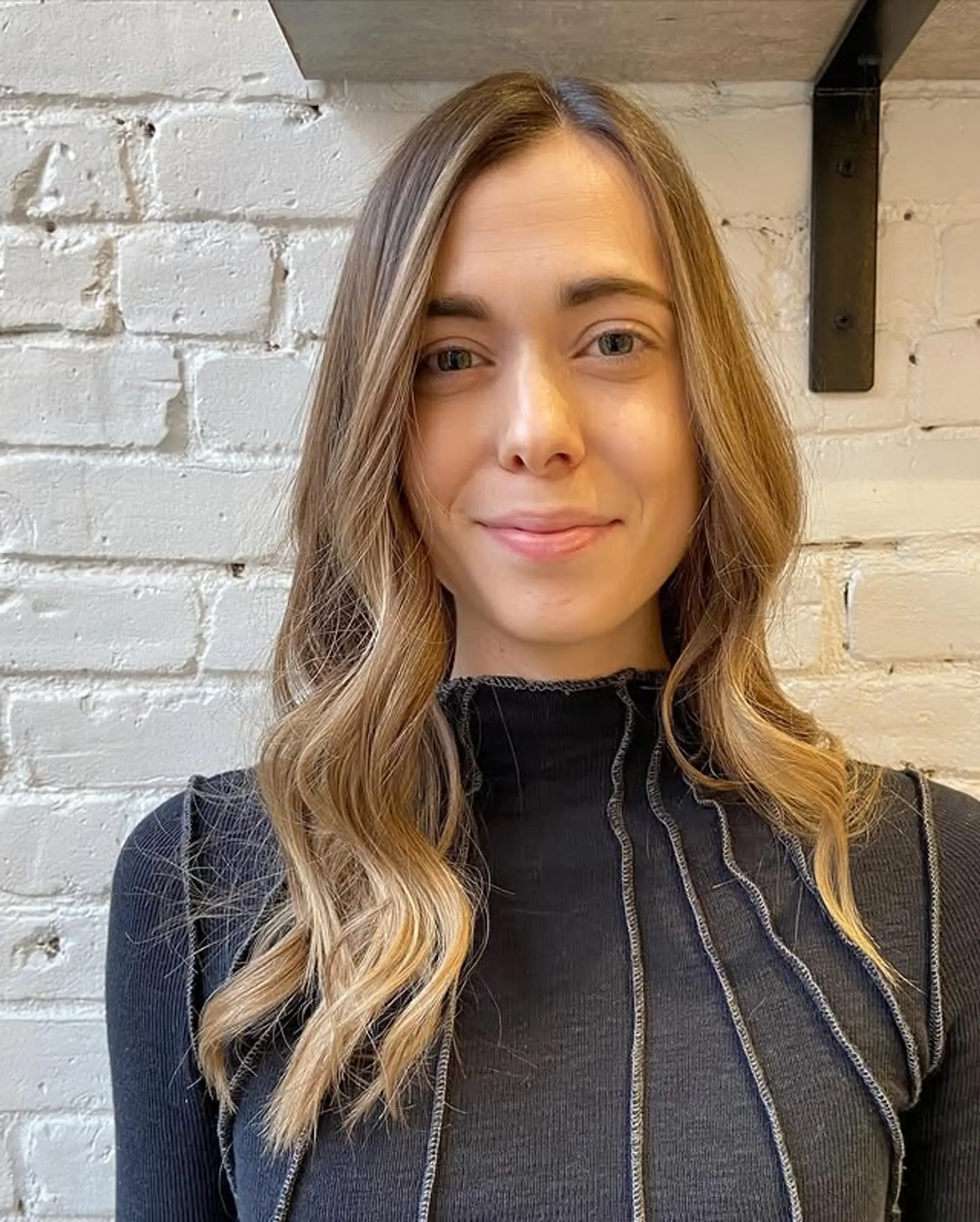 A long, wavy hairstyle with a subtle balayage effect. 1