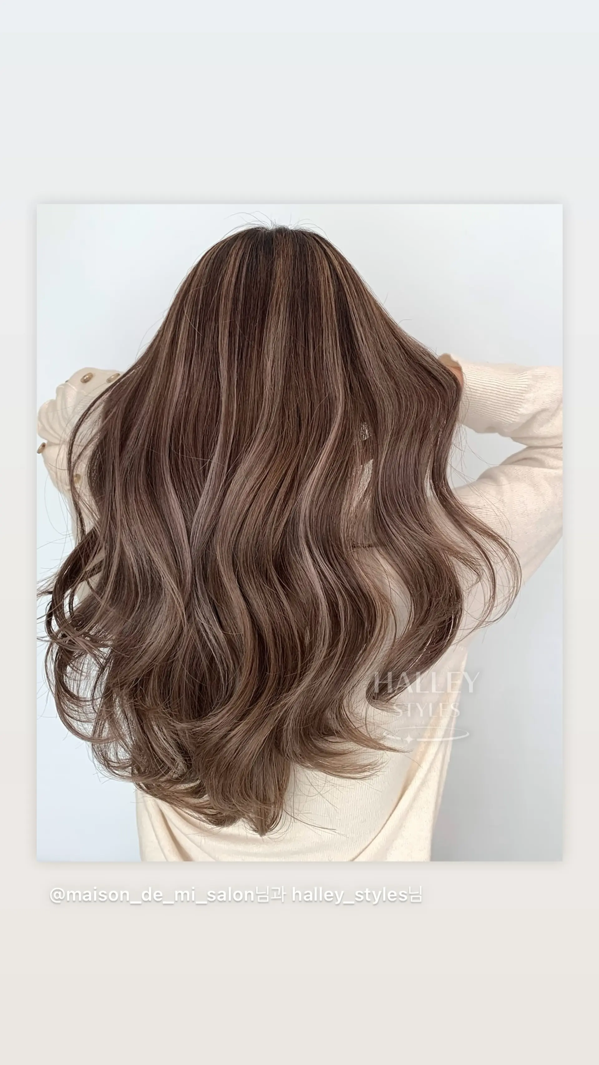 Long wavy hair with a soft, natural-looking balayage. 1